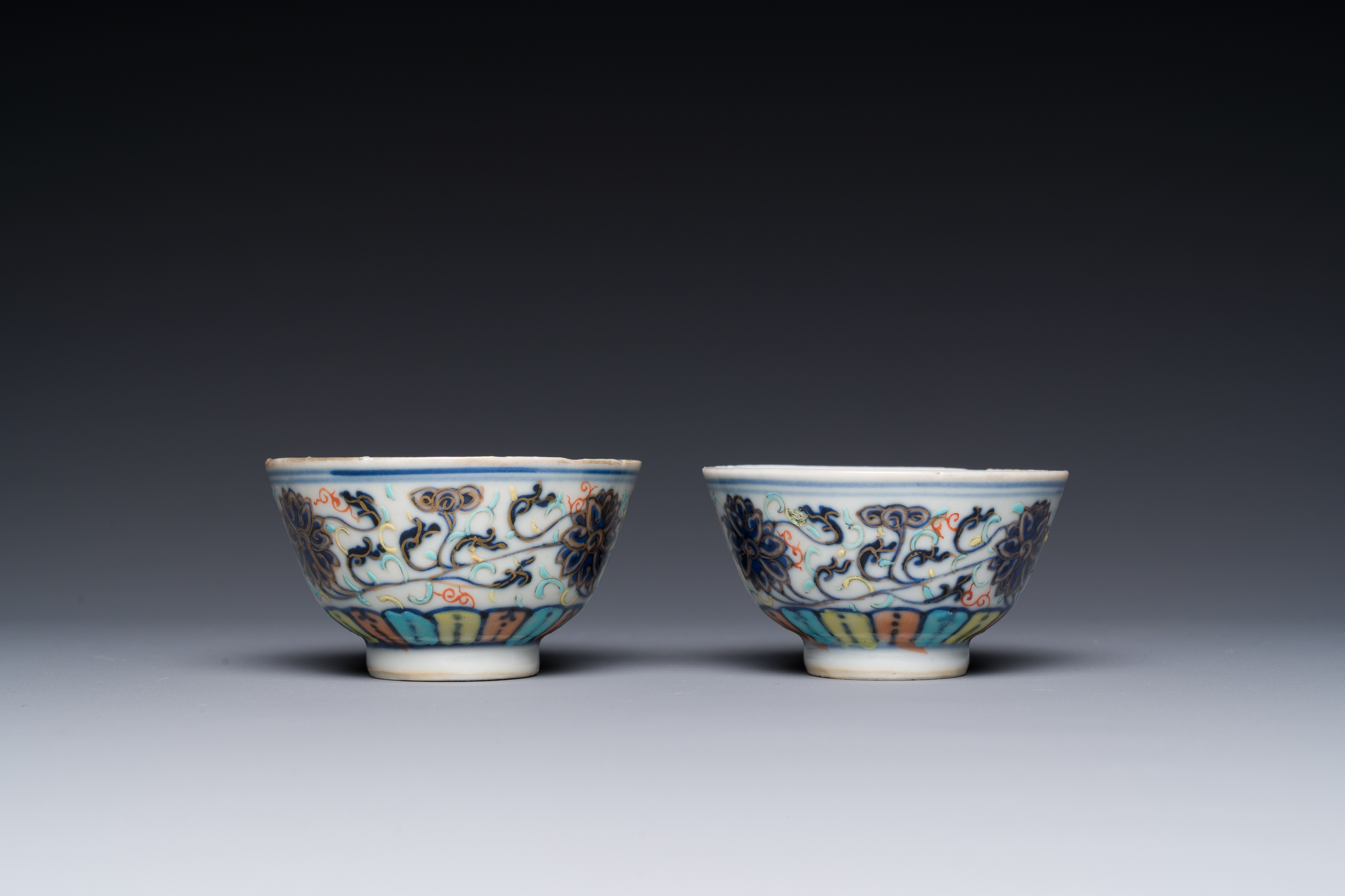 A pair of Chinese doucai 'lotus scroll' cups, Guangxu mark and of the period - Image 3 of 4