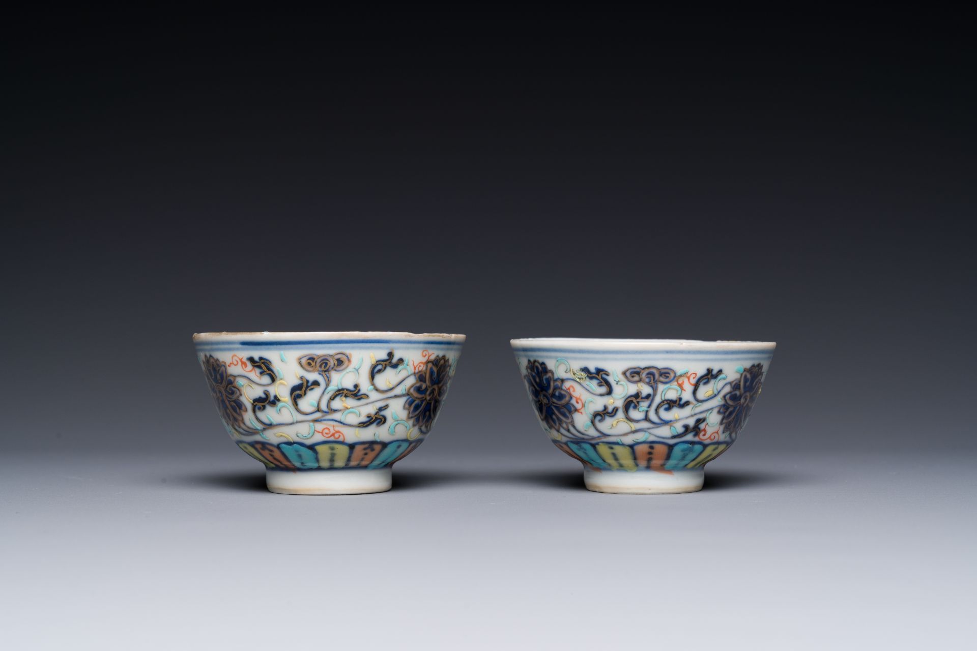 A pair of Chinese doucai 'lotus scroll' cups, Guangxu mark and of the period - Image 3 of 4