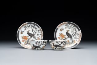 A pair of Chinese grisaille and gilded 'pheasant' cups and saucers, Yongzheng