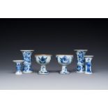 Two Chinese blue and white stem cups and four miniature 'gu' vases, Kangxi