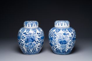 A pair of Chinese blue and white ginger jars and lid with floral design, Kangxi