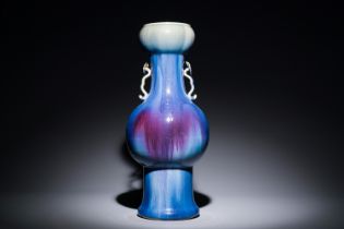 A Chinese flambe-glazed garlic-mouth vase with ruyi handles, 19th C.