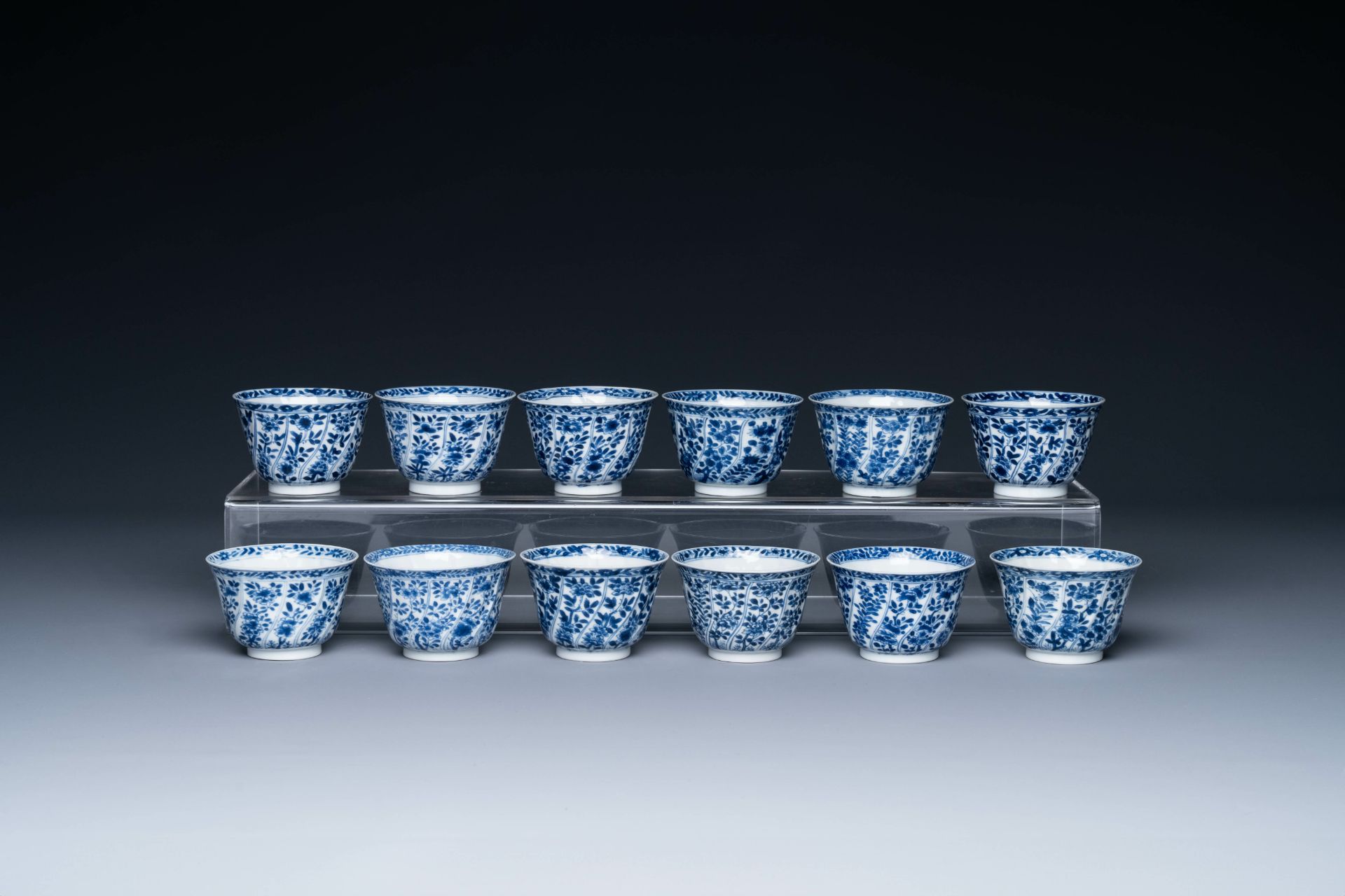 Twelve Chinese blue and white cups and saucers with floral design, jade mark, Kangxi - Image 5 of 7
