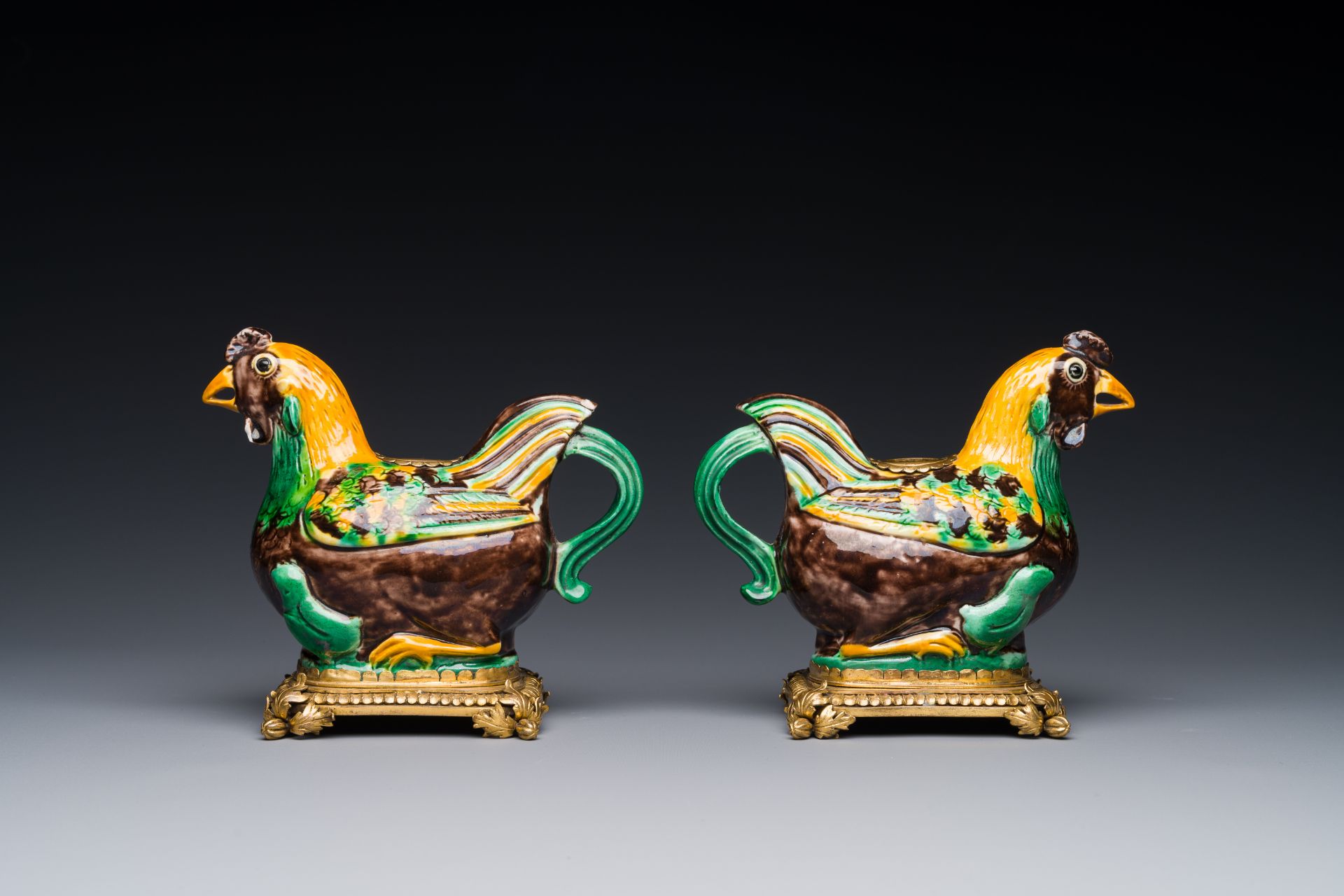 A pair of Chinese sancai-glazed chicken ewers mounted as candleholders with gilt bronze, Kangxi - Image 3 of 4