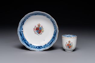 A Chinese famille rose armorial cup and saucer, Qianlong