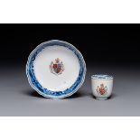 A Chinese famille rose armorial cup and saucer, Qianlong