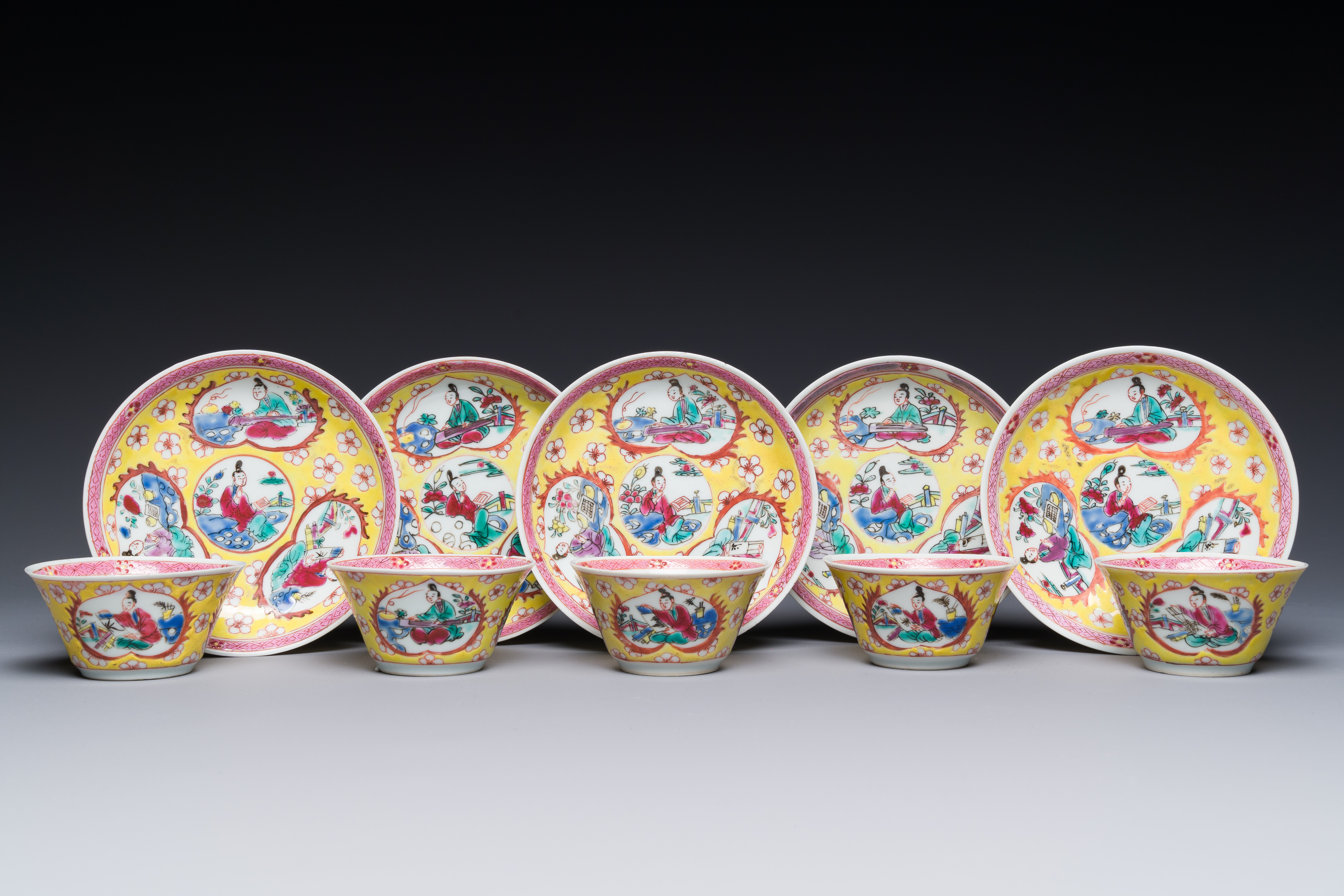 Five Chinese famille rose yellow-ground cups and saucers with 'four arts å››è—' decoration, Yongzhe