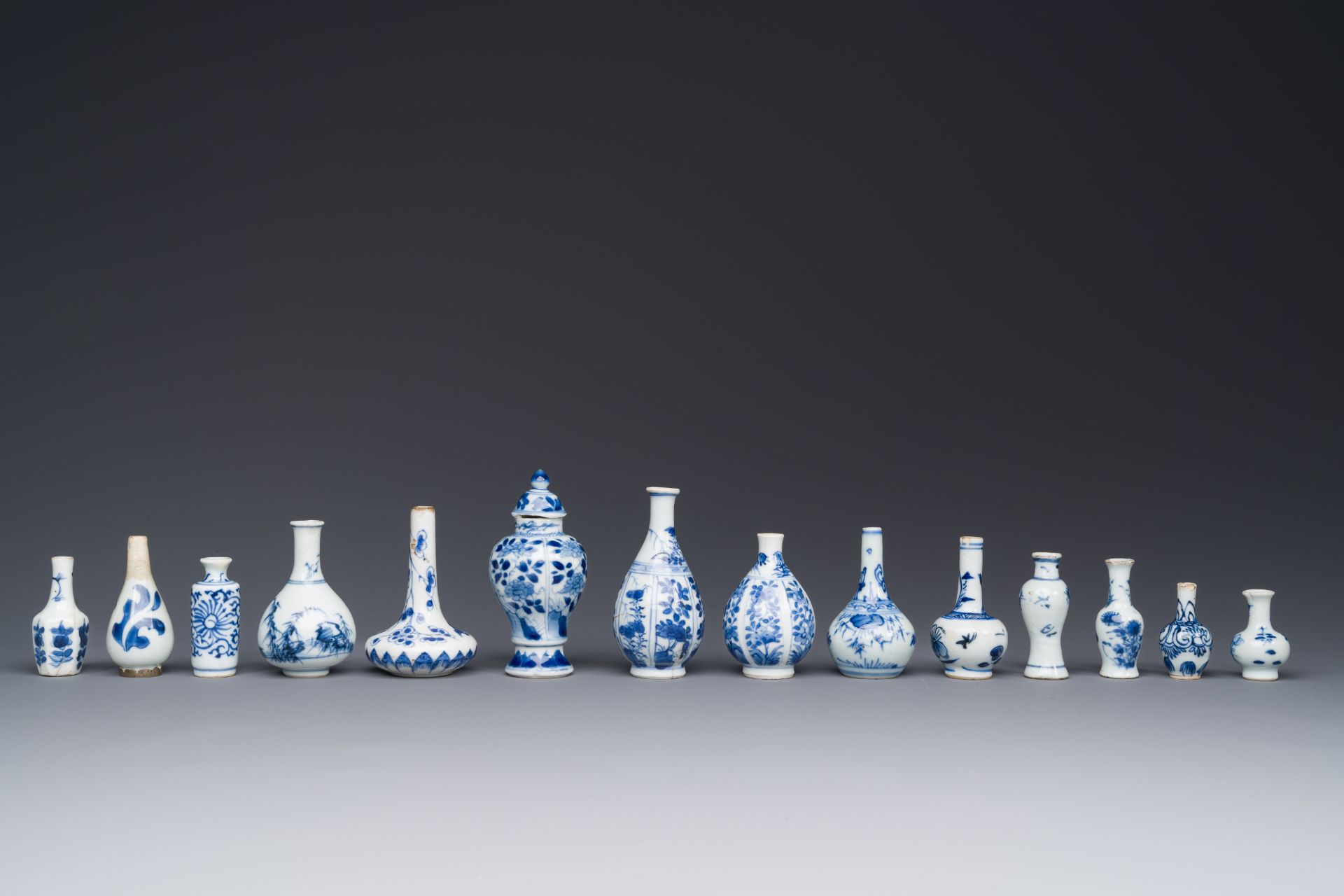 Fourteen Chinese blue and white miniature vases with floral design, Kangxi - Image 3 of 4