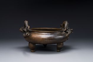 A large Chinese bronze tripod censer with 'chilong' handles, Qing Qian Gong æ¸…ä¹¾å®® mark, 18th C.