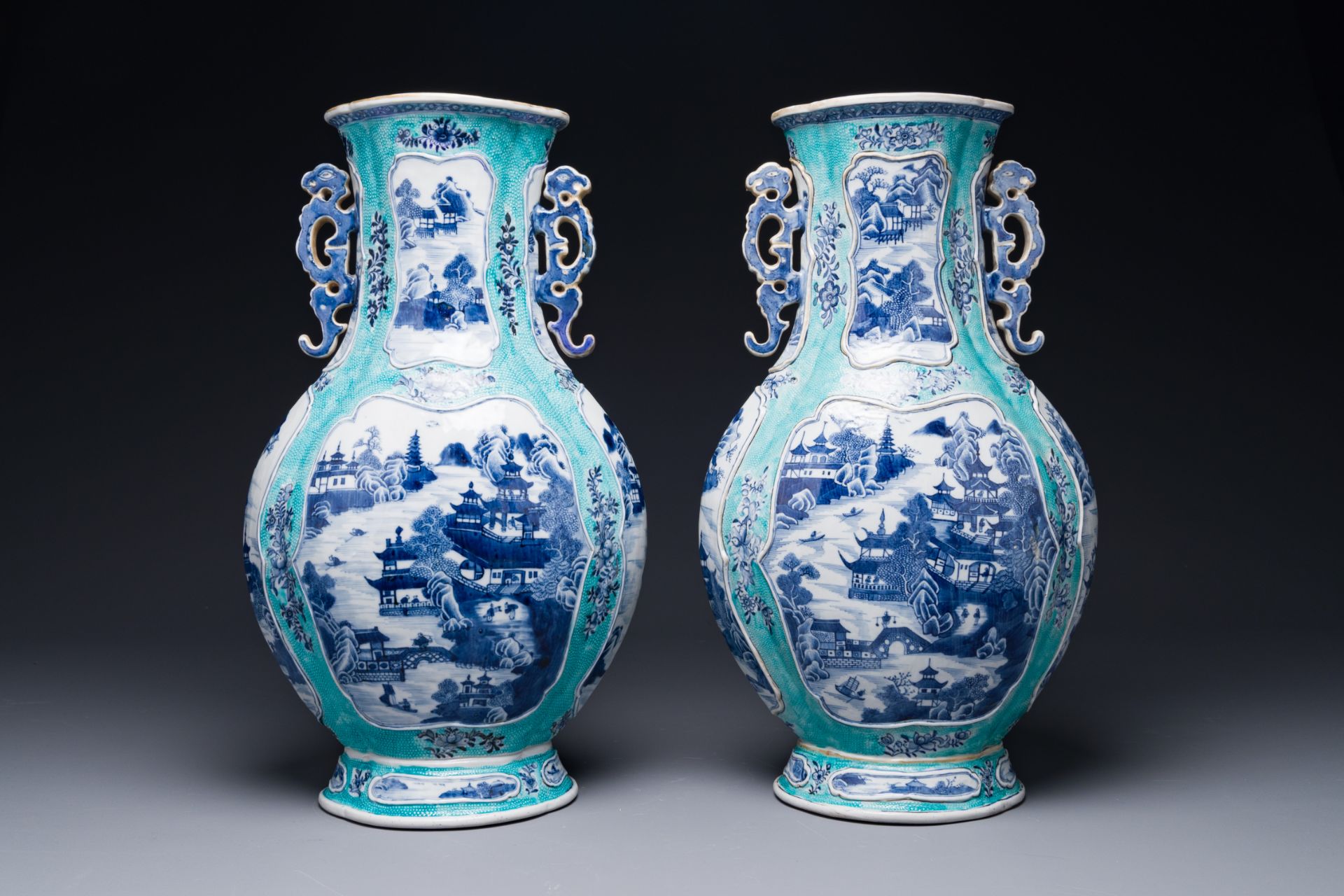 A pair of Chinese turquoise-ground blue and white vases depicting the Whampoa Pagoda and the Pearl R