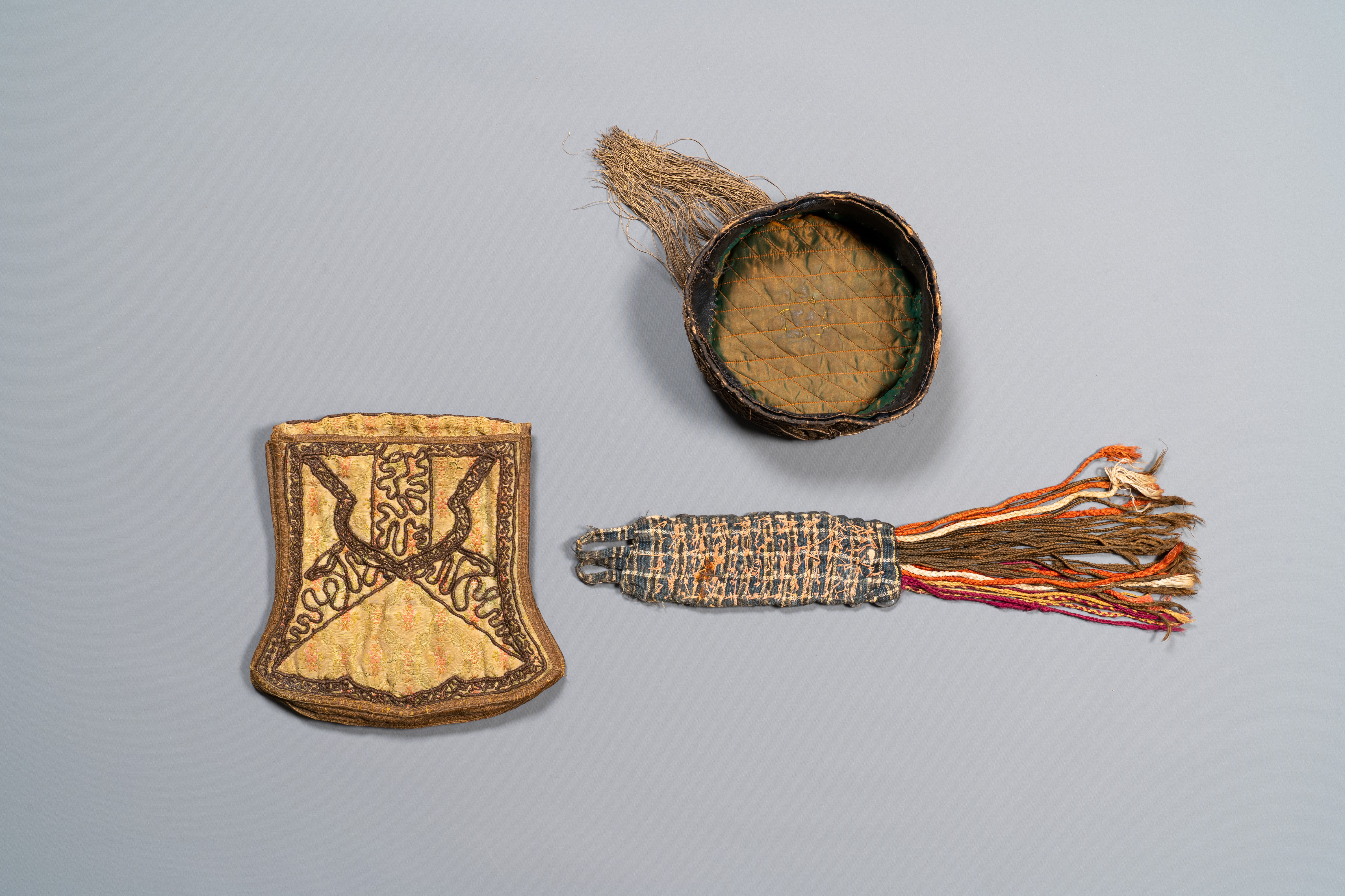 An Iranian gold-thread-embroidered silk caftan, a hat, a coin bracelet and a Koran holder, 19th C. - Image 6 of 7