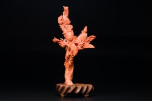 A Chinese red coral figure of 'Xiwangmu' on wooden stand, 19/20th C.
