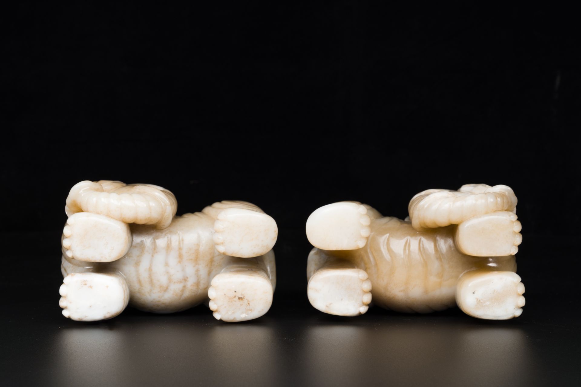 A pair of Chinese white and russet jade sculptures of elephants, Qianlong - Image 9 of 9