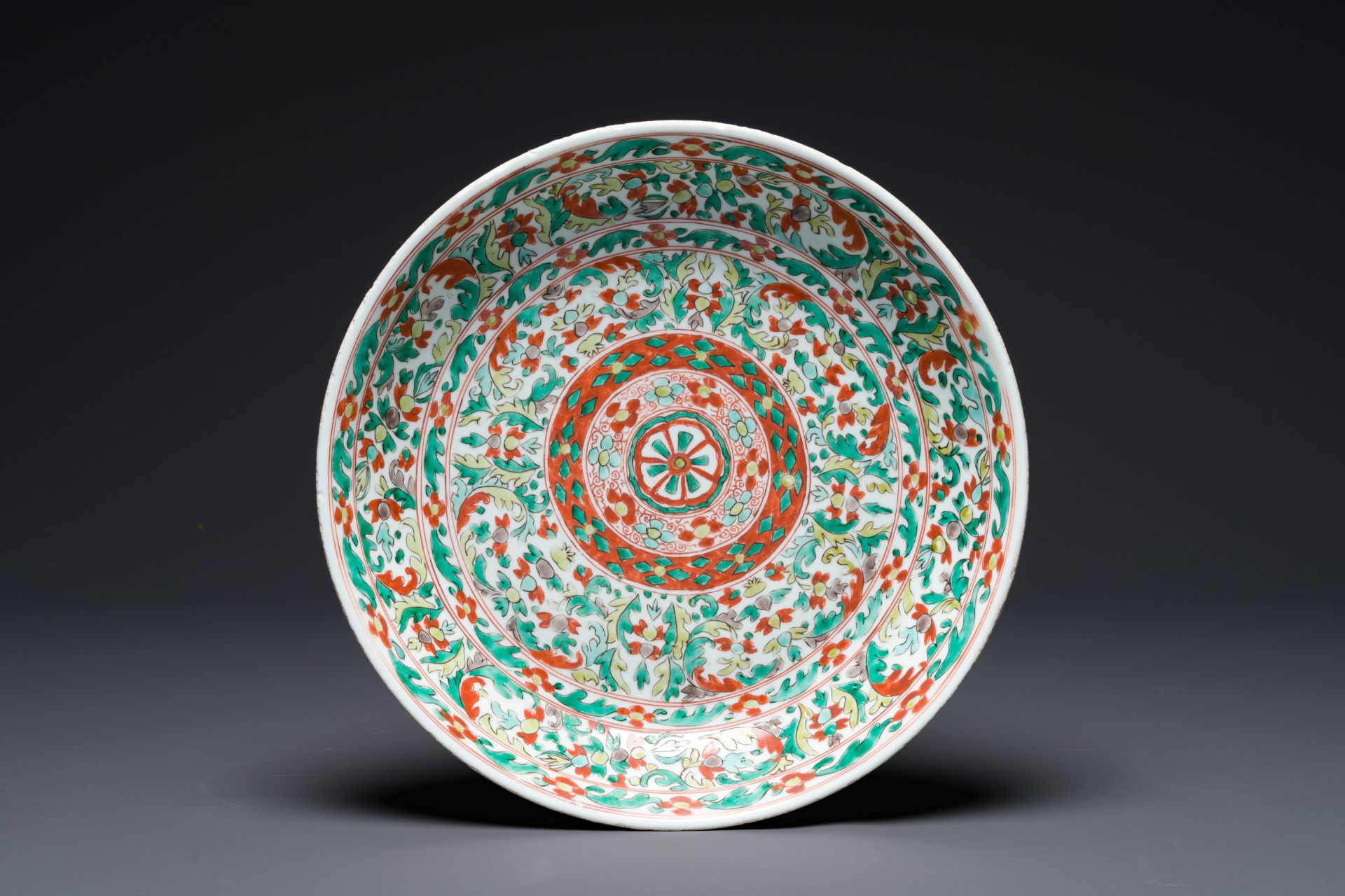 A Chinese wucai dish with stylized floral design, Kangxi