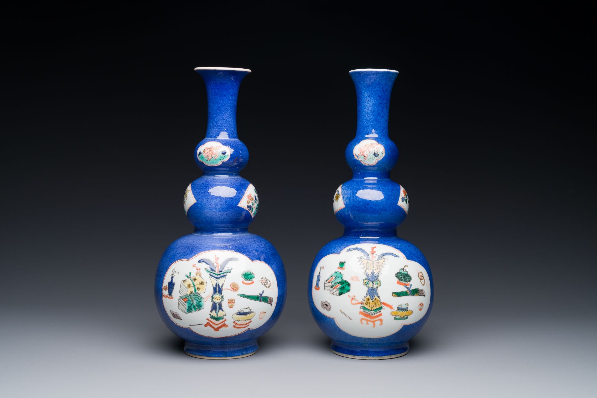 A pair of Chinese famille verte powder-blue-ground triple gourd 'antiquities' vases, Kangxi - Image 2 of 3