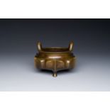 A Chinese bronze lotus-shaped tripod censer, Xuande mark, 18/19th C.