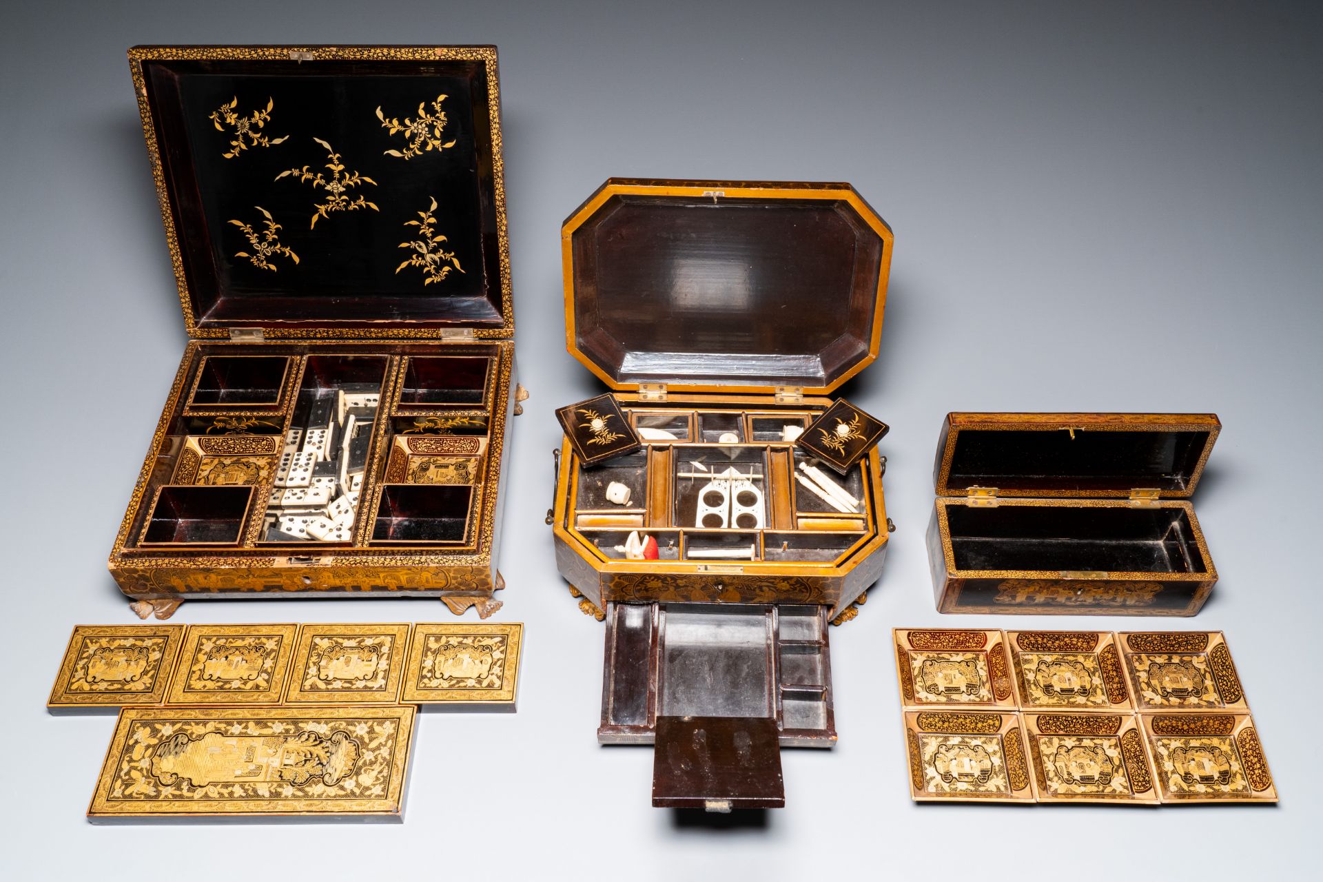 A large Chinese Canton gilt black lacquer tray, thee boxes and a fan, 19th C. - Image 16 of 17