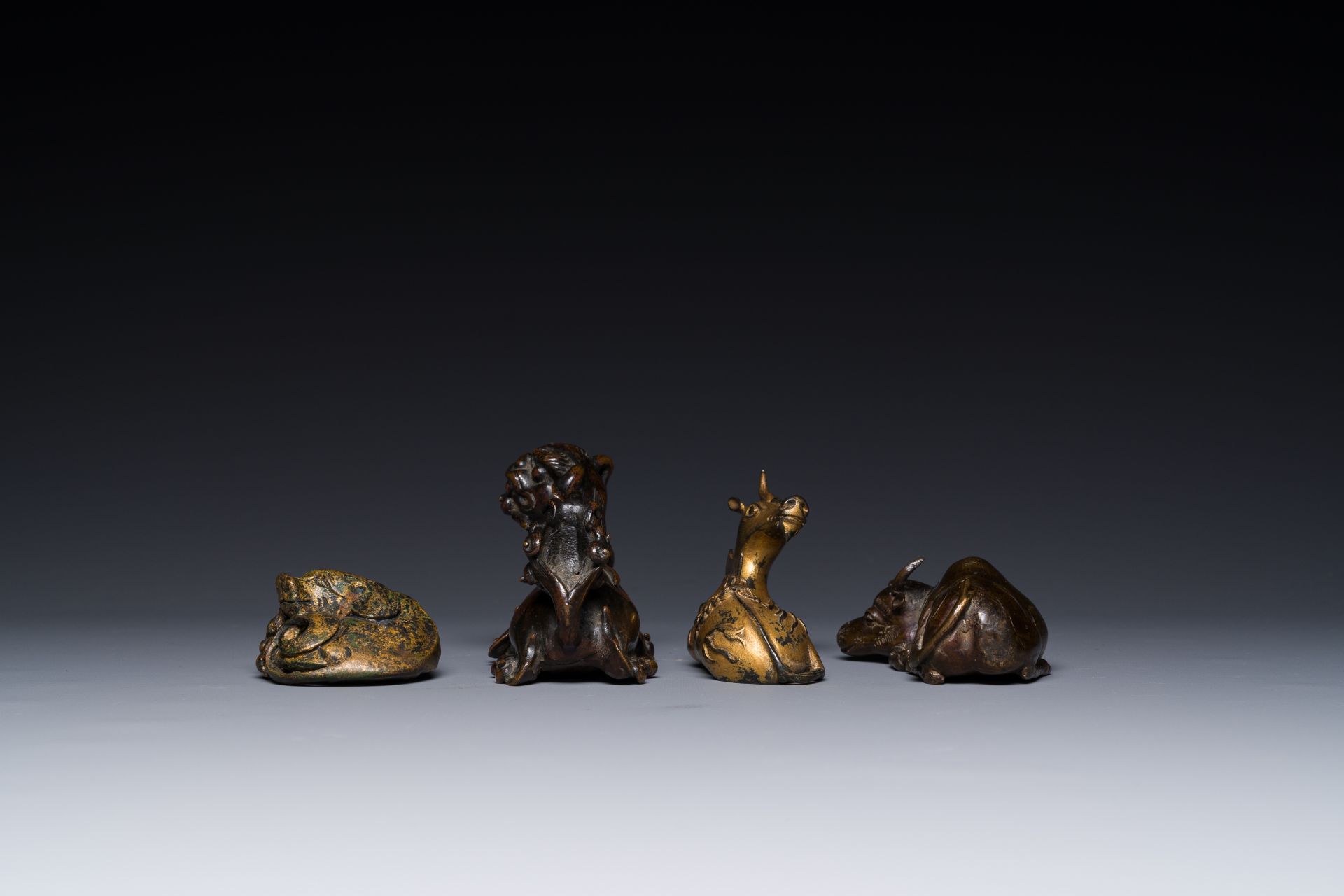 A group of four Chinese gilt bronze paper-weights, Ming/Qing - Image 5 of 7