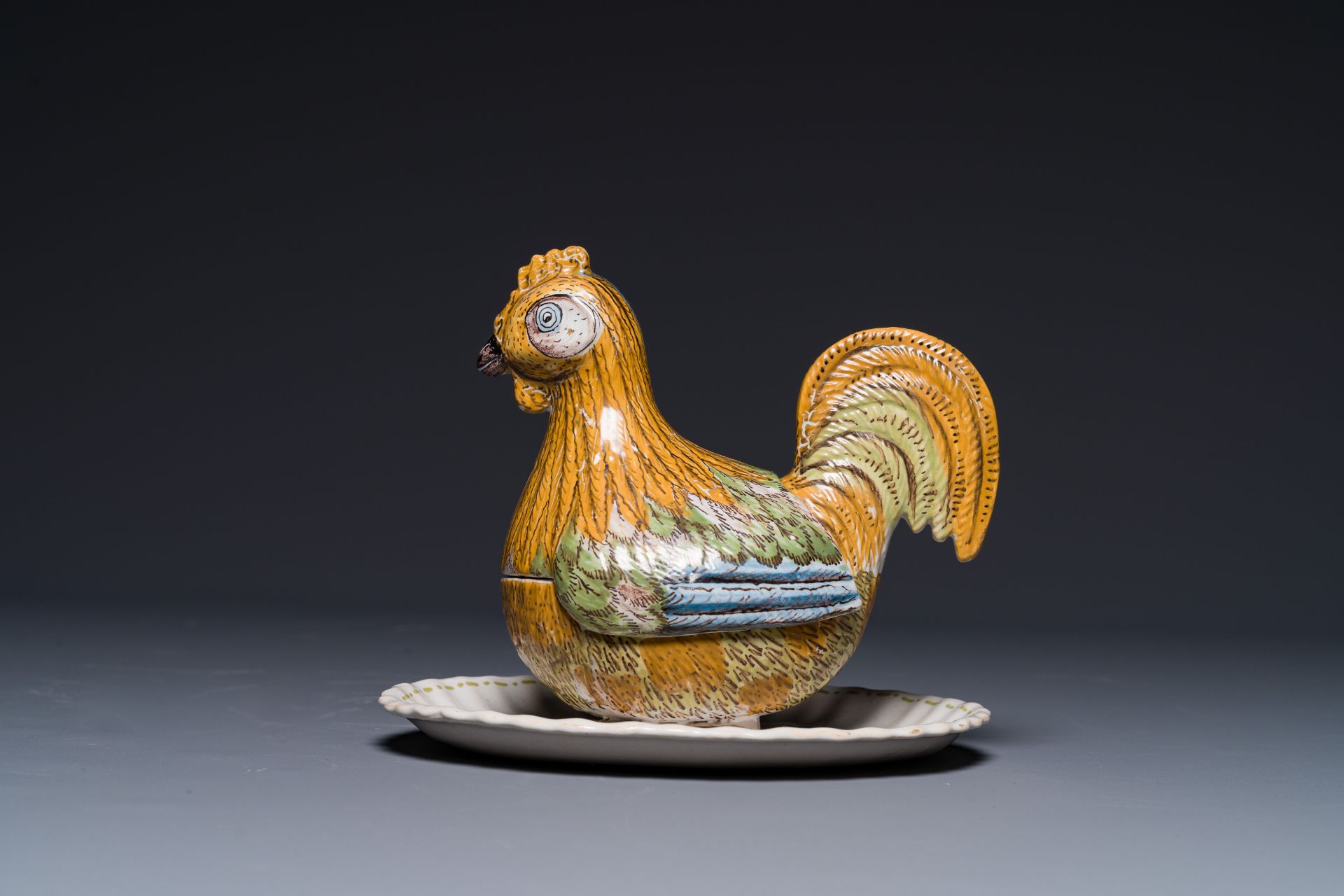 A German polychrome faience rooster-shaped tureen and cover, Abtsbessingen, 18th C.