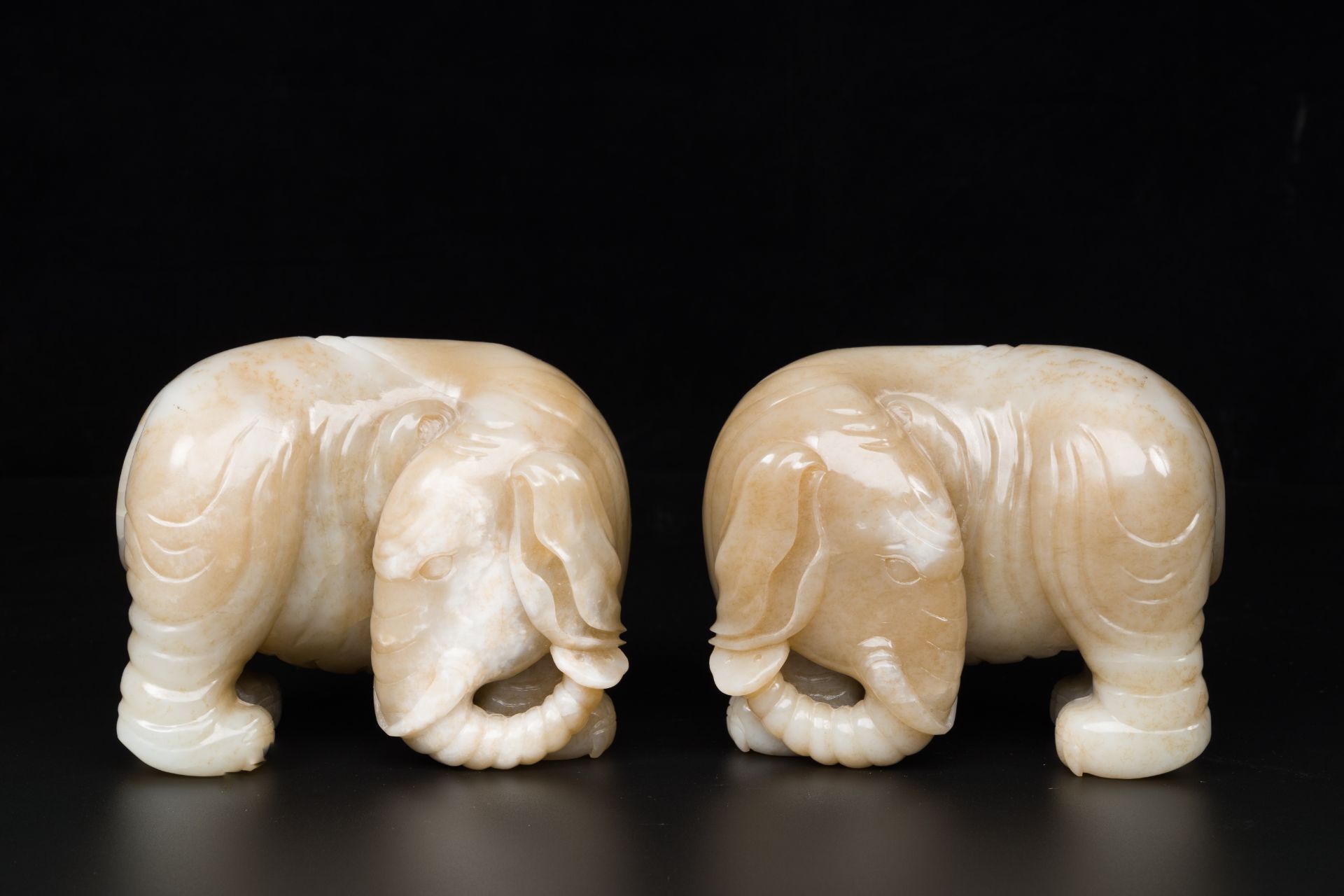 A pair of Chinese white and russet jade sculptures of elephants, Qianlong - Image 3 of 9