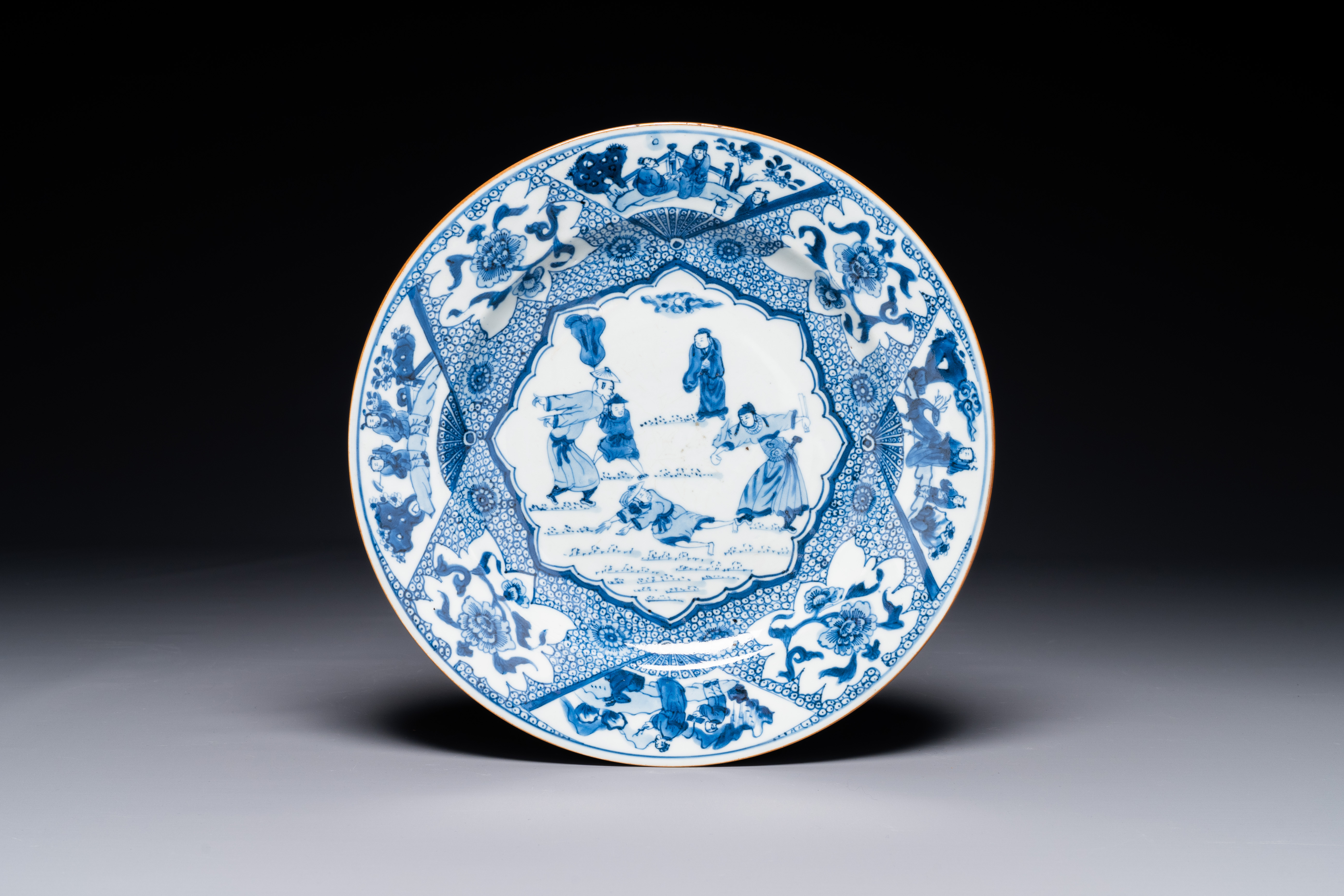 A blue and white Chinese plate with a punishment scene, Yongzheng/Qianlong