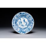 A blue and white Chinese plate with a punishment scene, Yongzheng/Qianlong