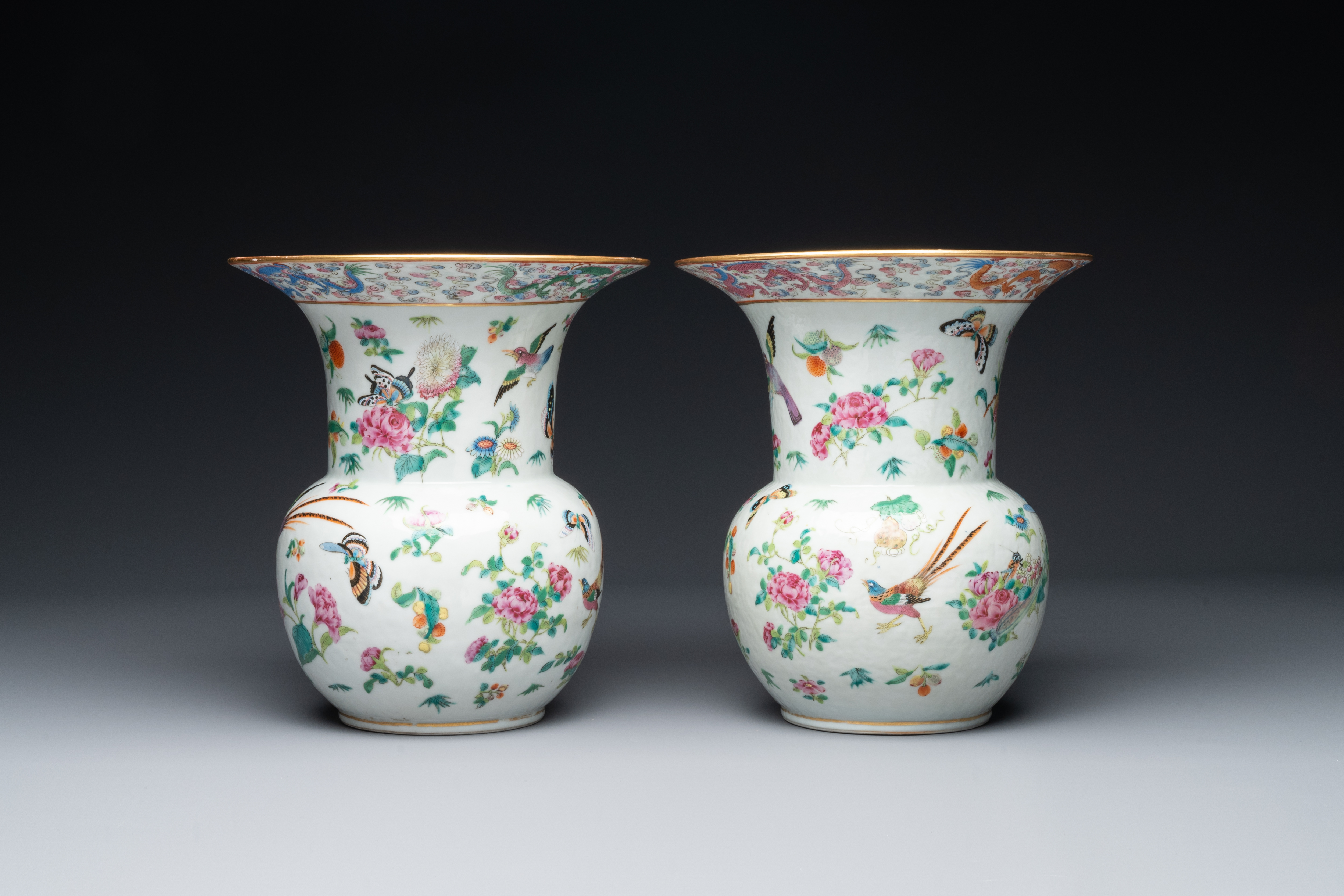A pair of Chinese Canton famille rose spittoons with dragons, birds, butterflies and flowers, 19th C - Image 2 of 6