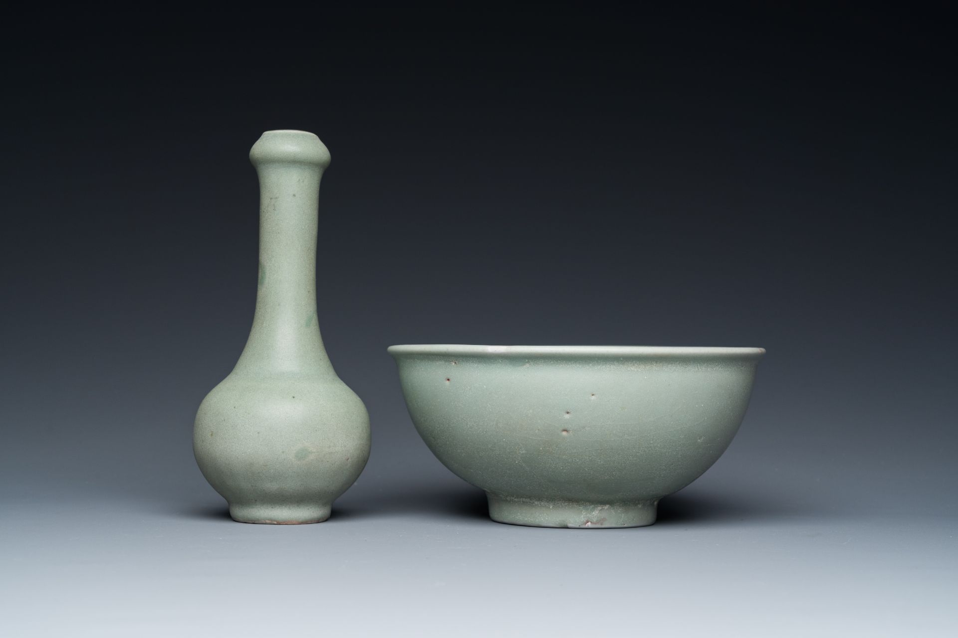 A Chinese celadon-glazed bottle vase and two bowls, Yuan/Ming - Image 4 of 9