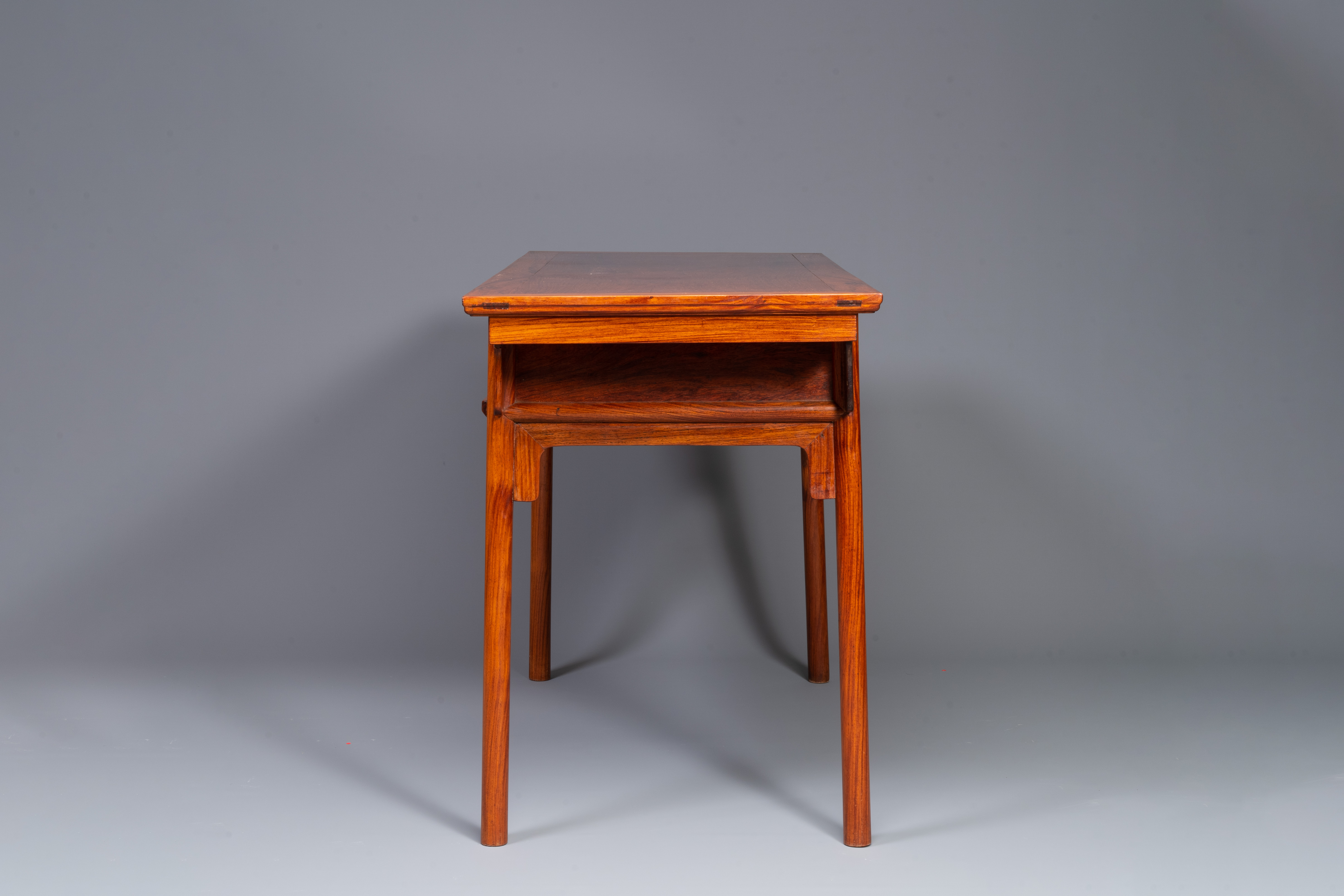 A Chinese huanghuali wooden two-drawer recessed-leg table, 19/20th C. - Image 5 of 13