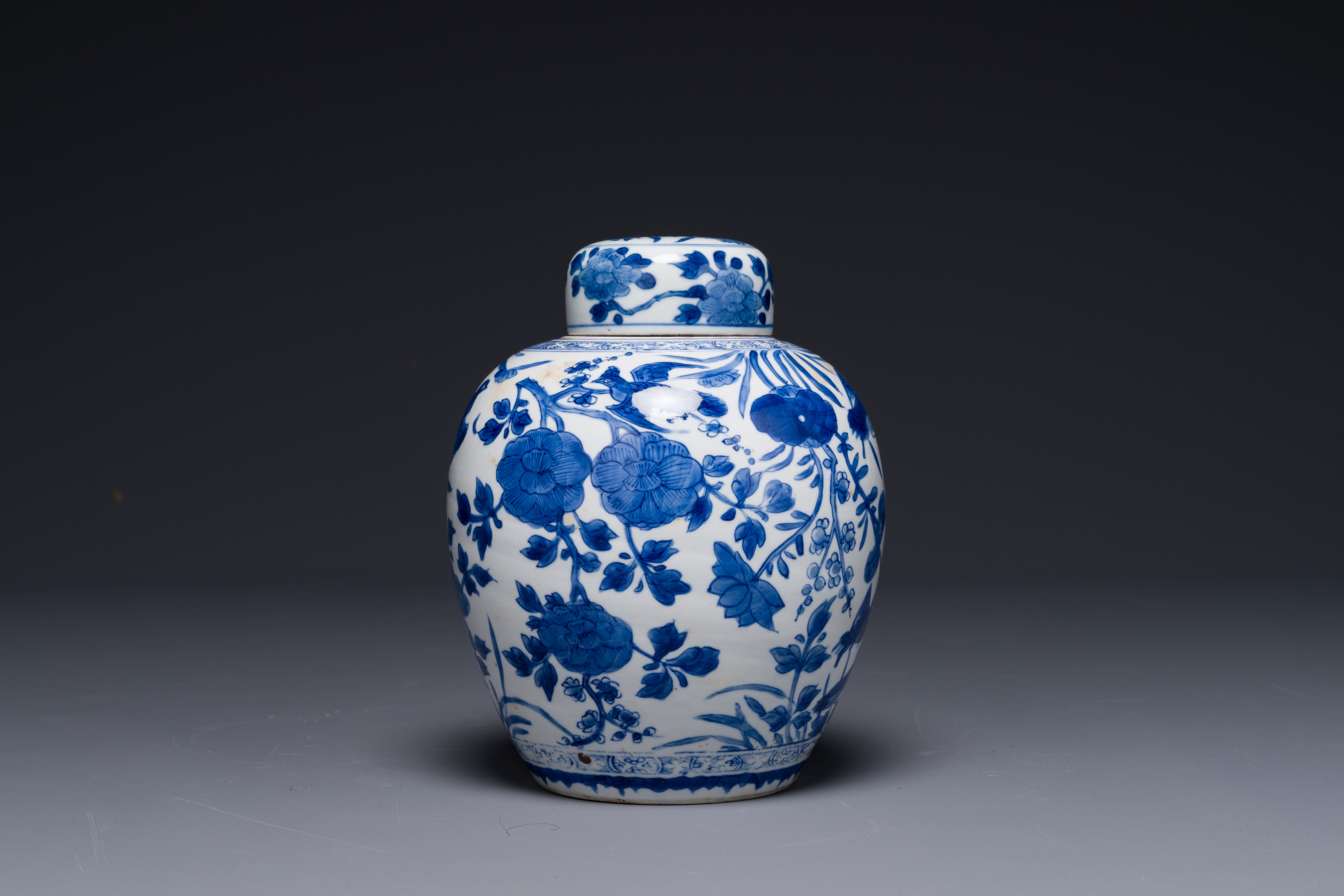 A Chinese blue and white jar and cover with floral design, Kangxi