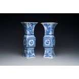 A pair of Chinese blue and white 'gu' vases with floral design, Kangxi