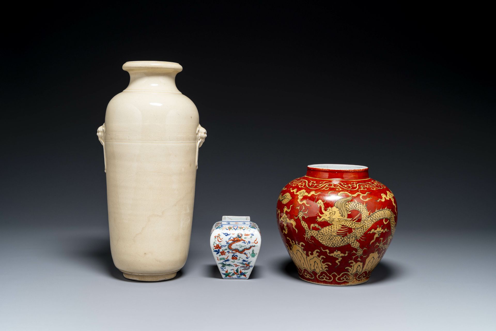 A Chinese cream-glazed vase and two 'dragon' vases, Jiajing and Wanli mark, 19/20th C. - Image 2 of 4