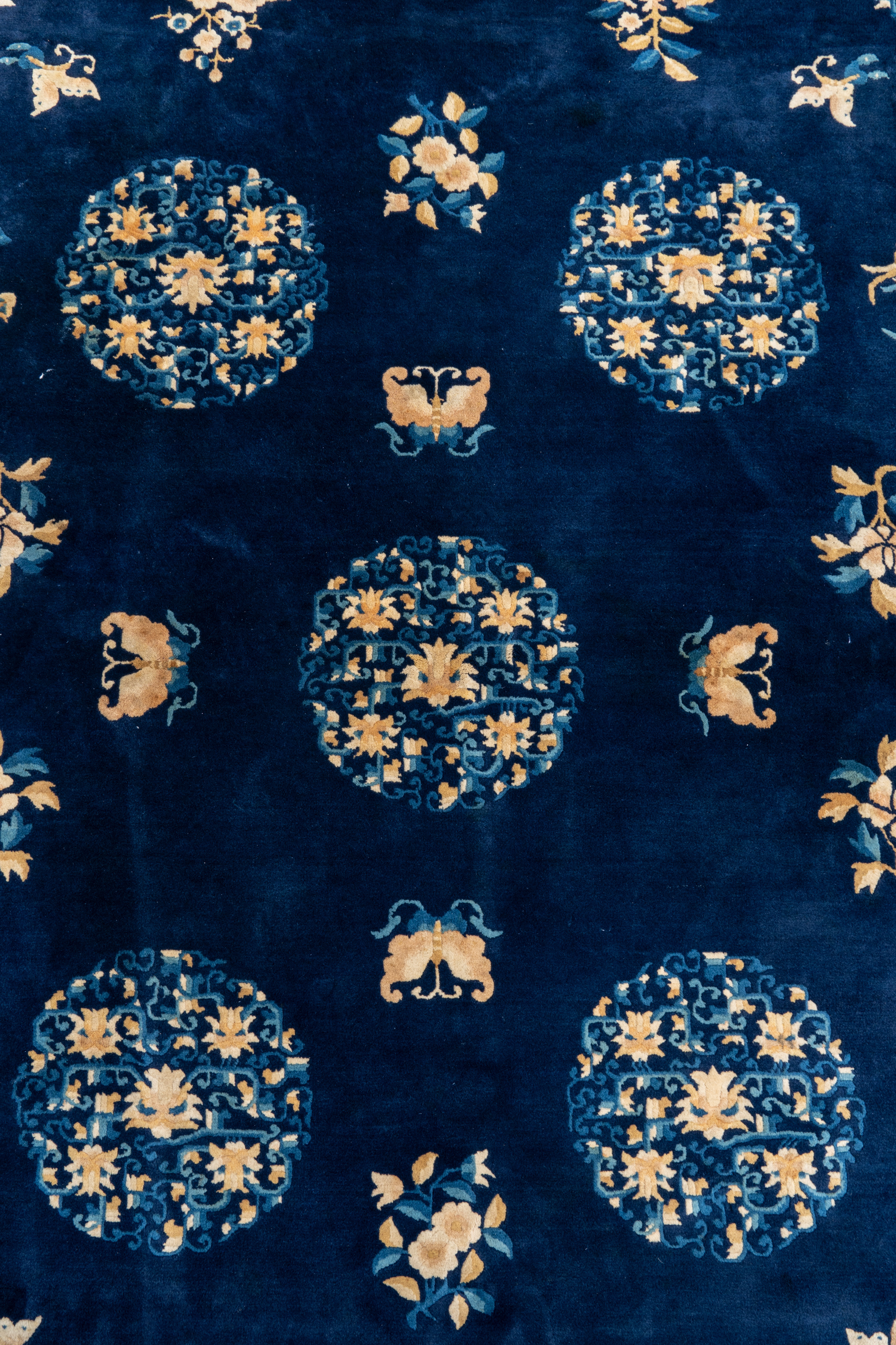 A large Chinese dark-blue-ground carpet with flowers and butterflies, 19/20th century - Image 3 of 5