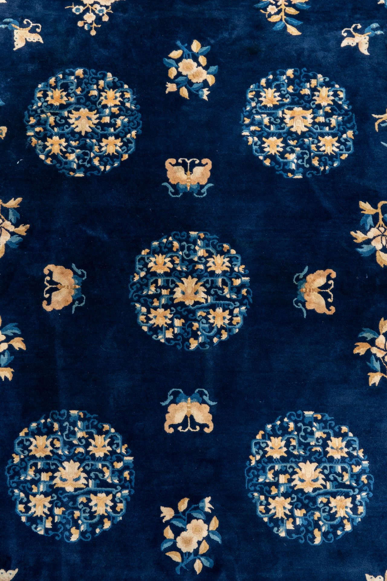A large Chinese dark-blue-ground carpet with flowers and butterflies, 19/20th century - Image 3 of 5