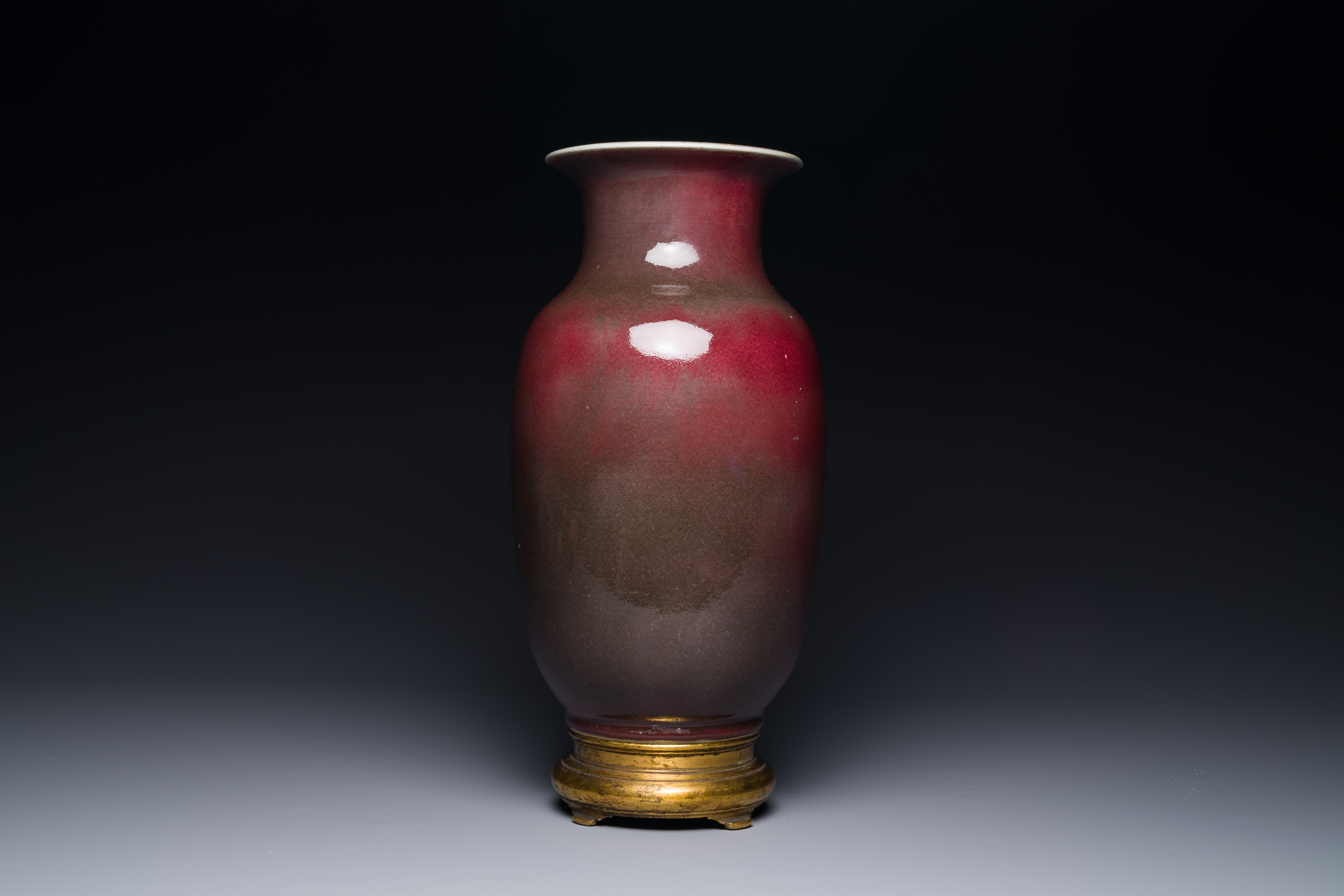 A Chinese monochrome copper-red-glazed vase with gilt bronze mount, 18/19th C