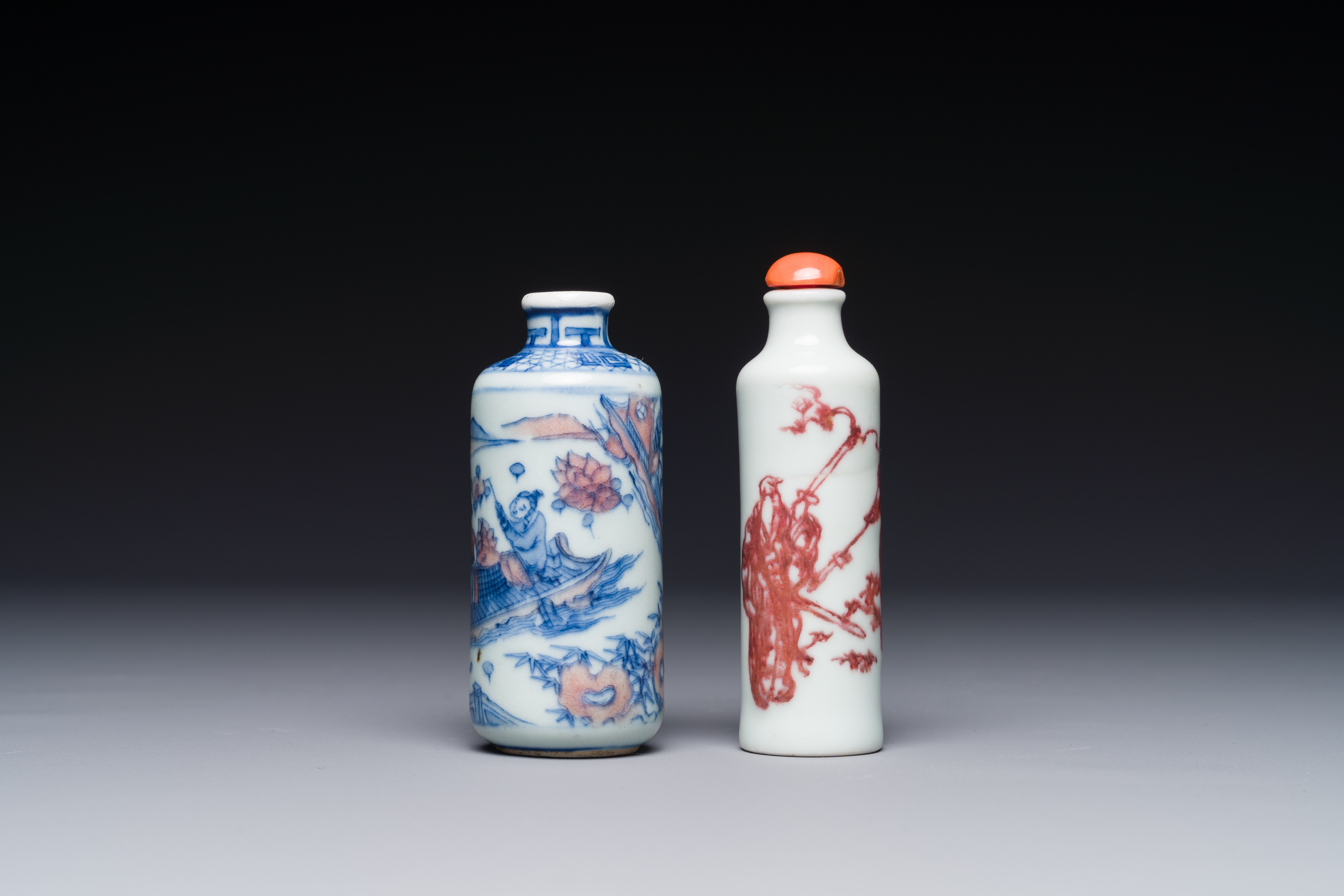 Two Chinese blue, white and copper-red snuff bottles, Qianlong mark, 19th C.