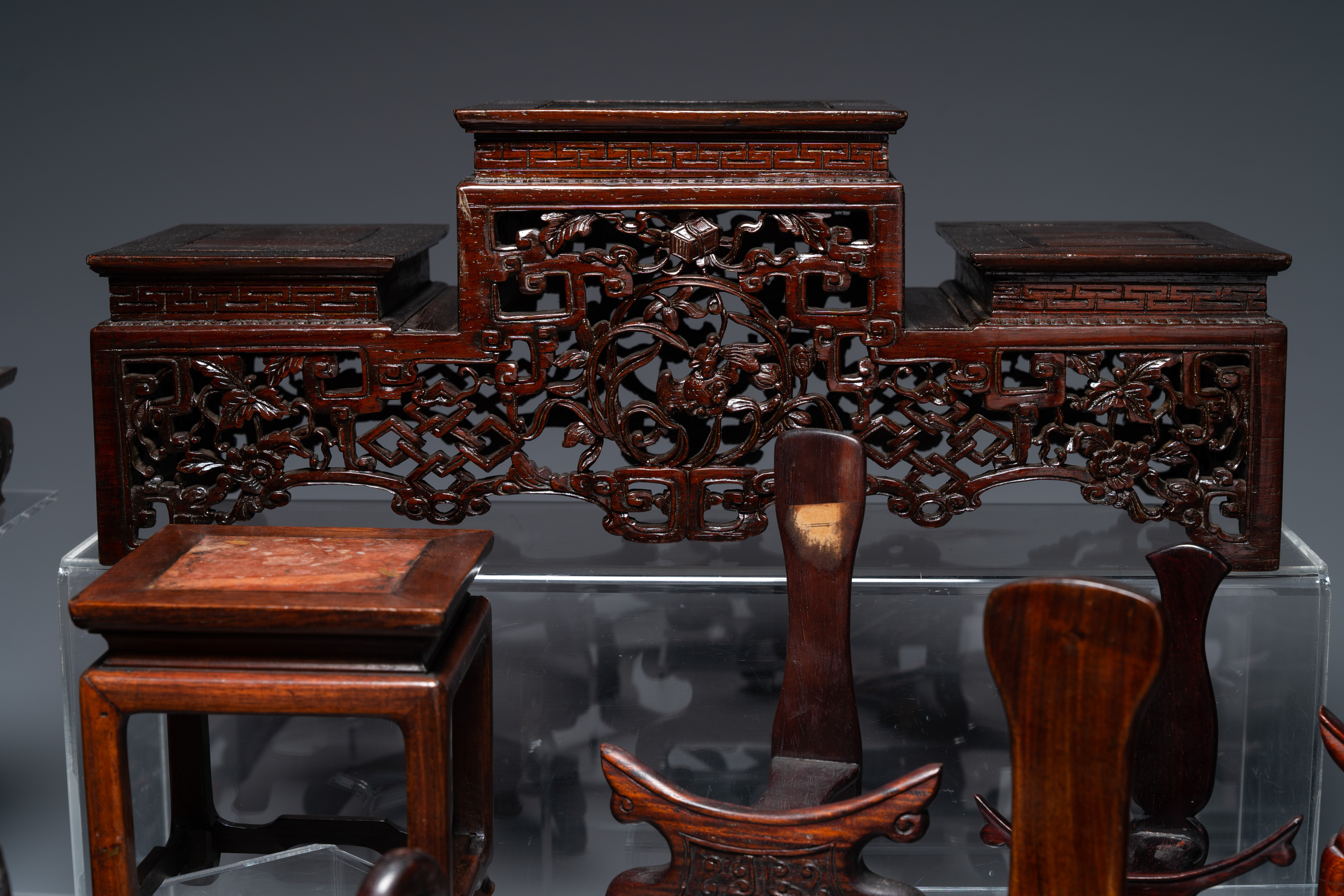 A collection of 26 varied Chinese wooden stands, 2 with marble tops, 19/20th C. - Image 6 of 6