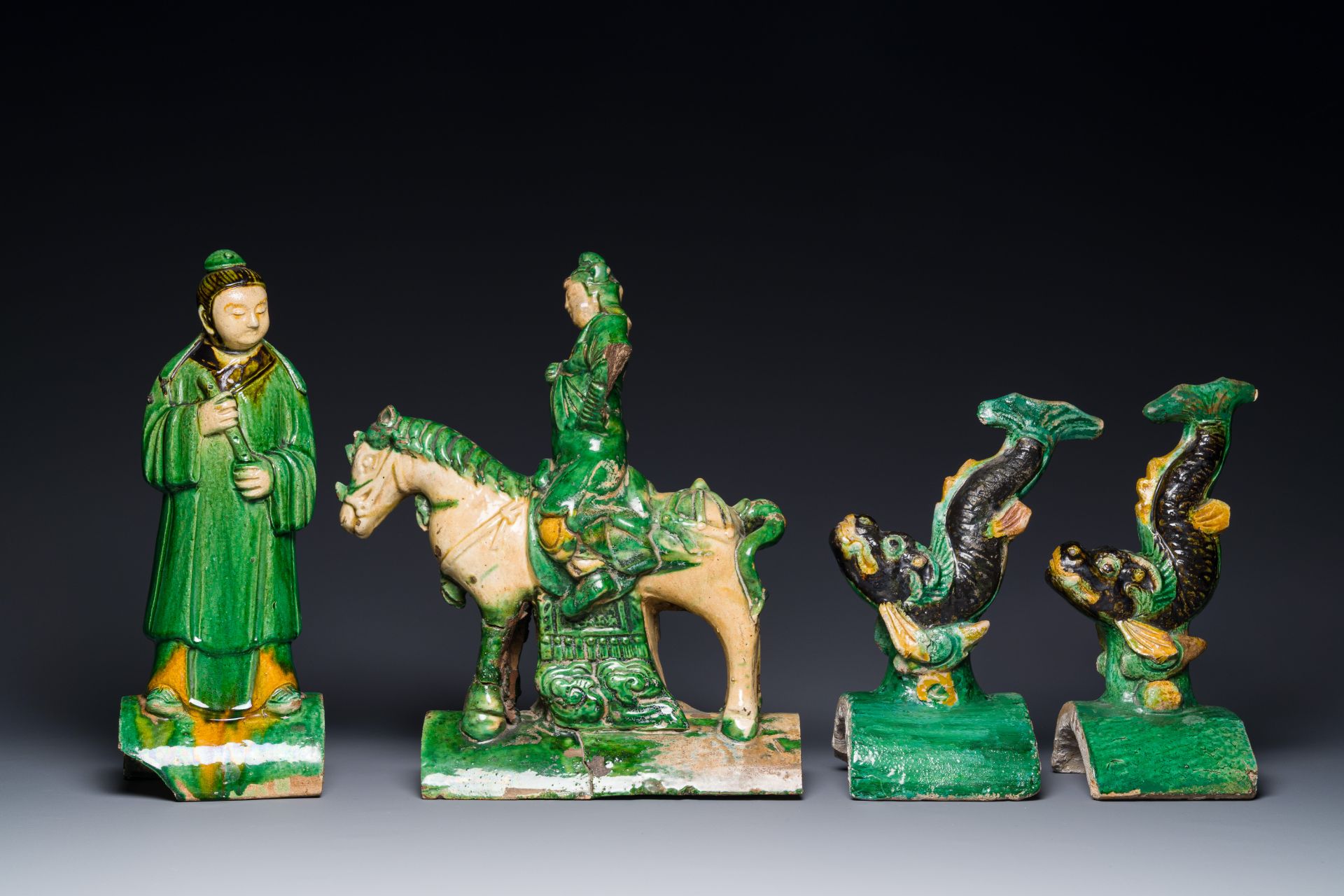 A pair of Chinese sancai roof tiles in the shape of a fish, a warrior on horseback and a sage, Ming - Image 2 of 4