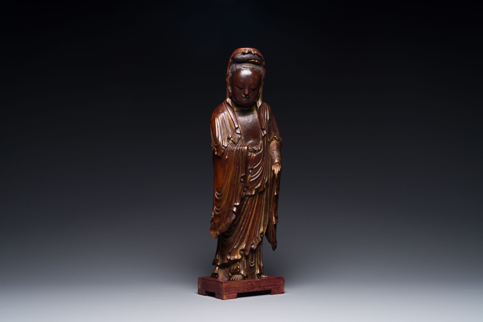 A Chinese partly gilt and lacquered wooden sculpture of Guanyin, Ming