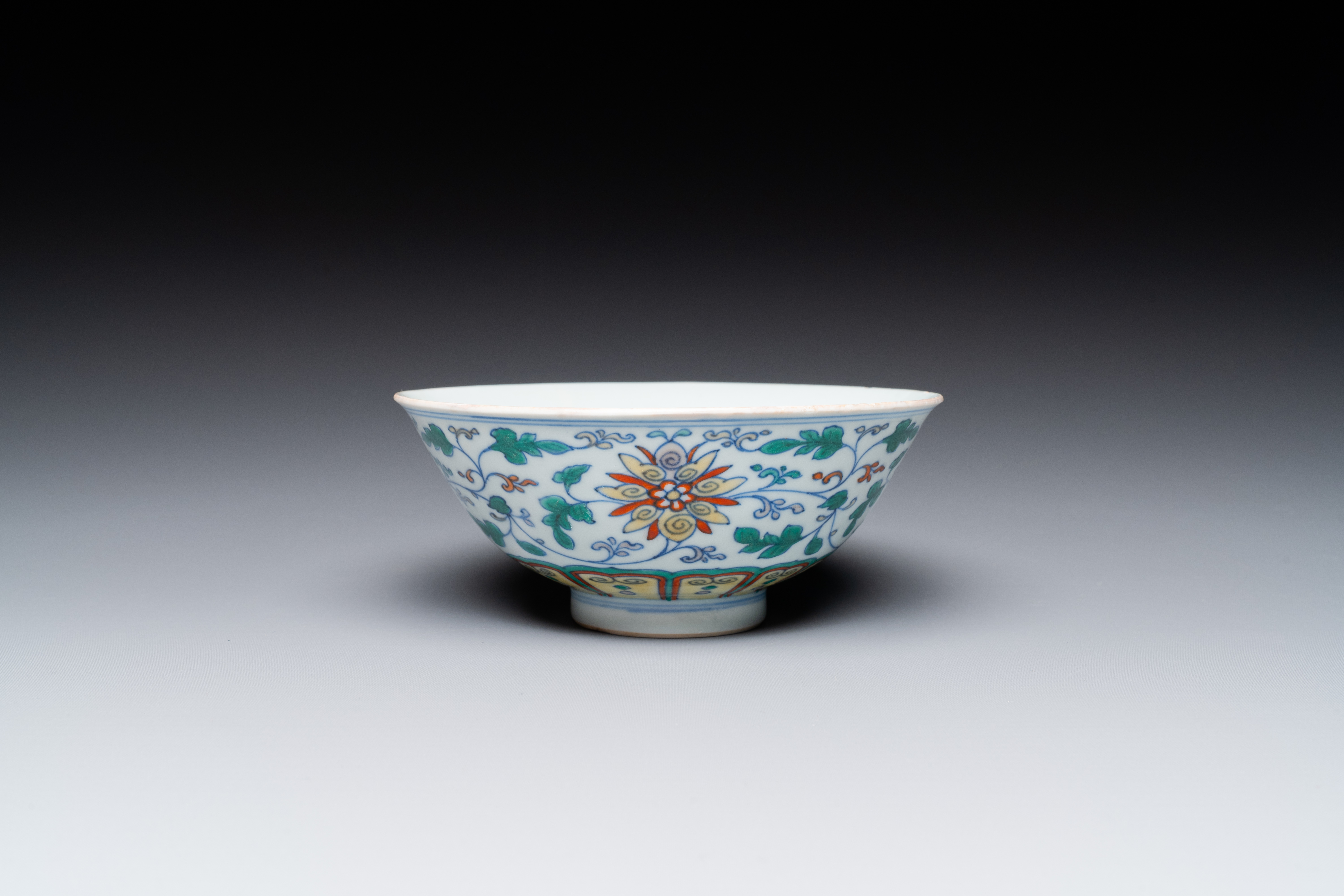 A Chinese doucai 'lotus scroll' bowl, Qianlong mark and of the period