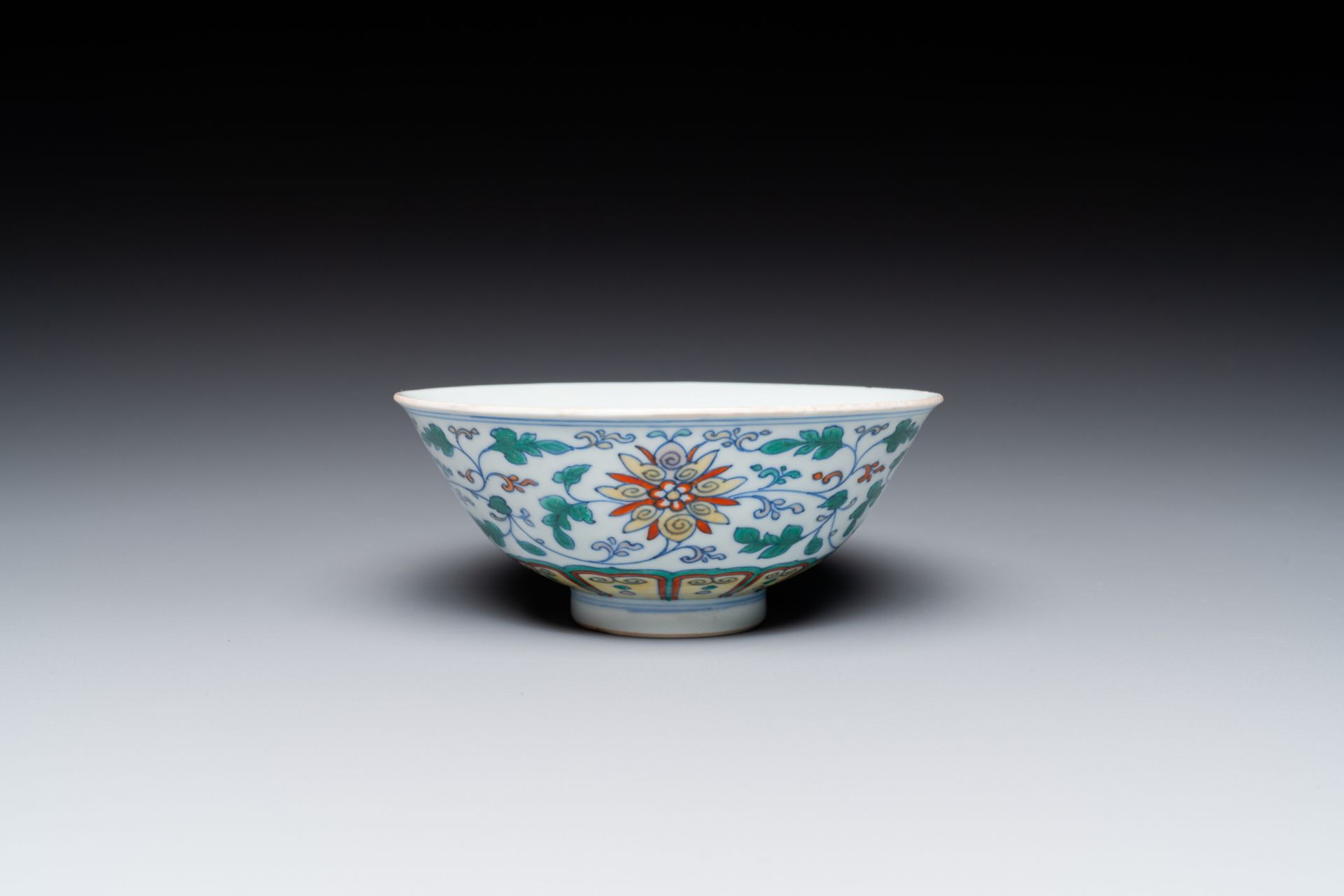 A Chinese doucai 'lotus scroll' bowl, Qianlong mark and of the period