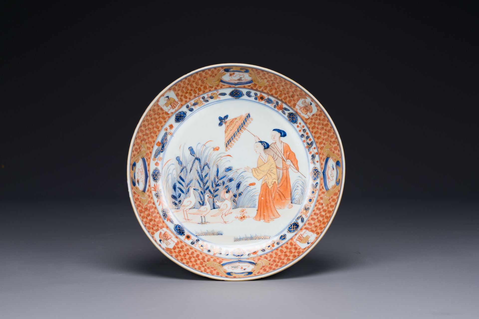 A Chinese Imari-style plate with 'Parasol ladies' after Cornelis Pronk, Qianlong