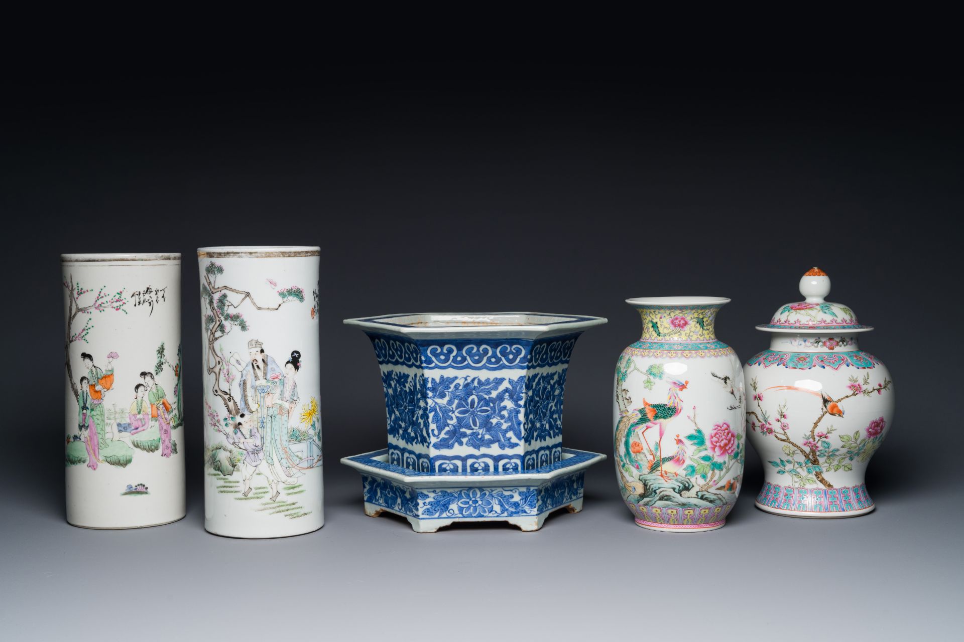 Two Chinese qianjiang cai hat stands, a blue and white jardiniere on stand, a famille rose vase and