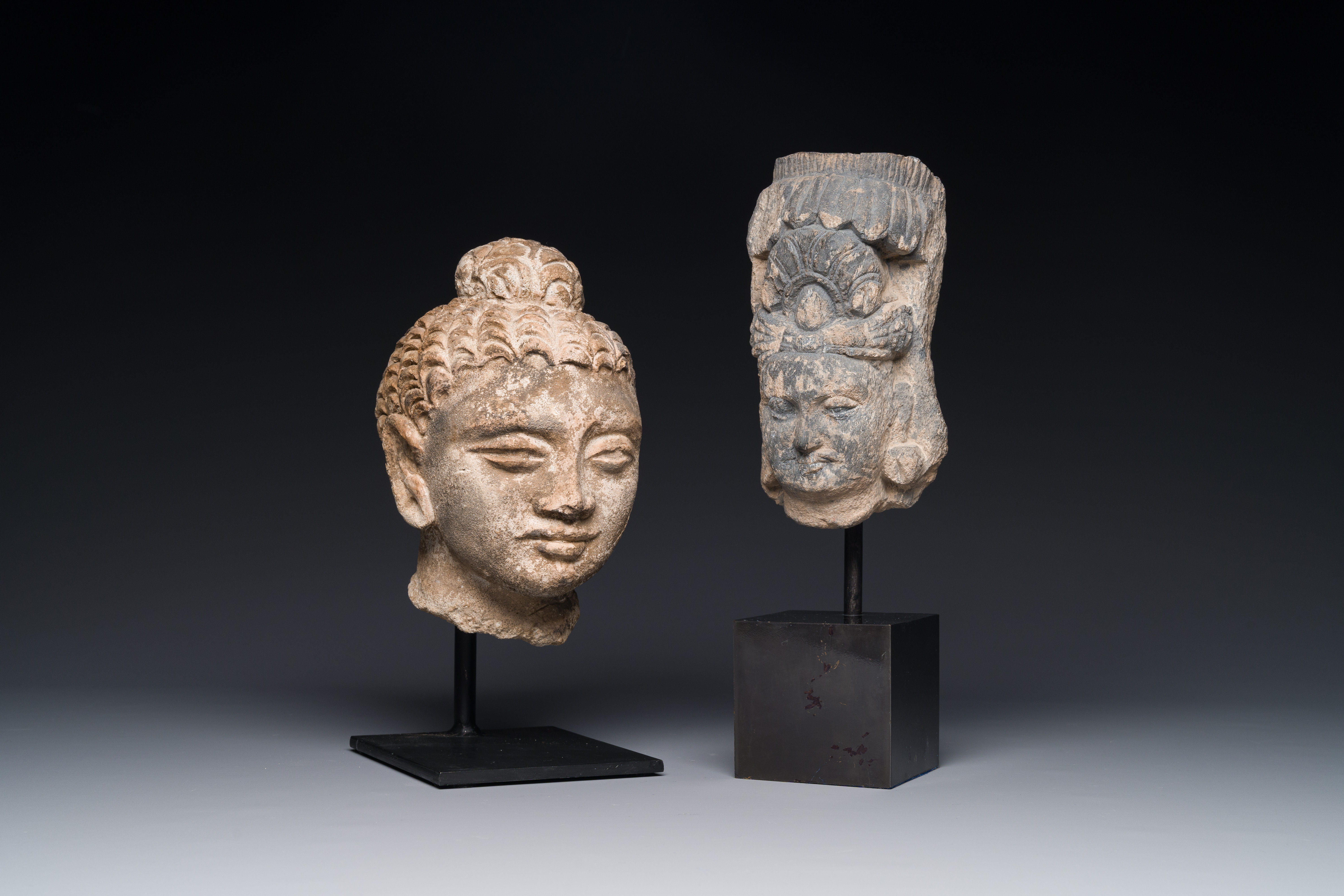 A Gandhara fragment of a stucco Sakyamuni head and a grey schist Bodhisattva head, 1/4th C. - Image 2 of 12