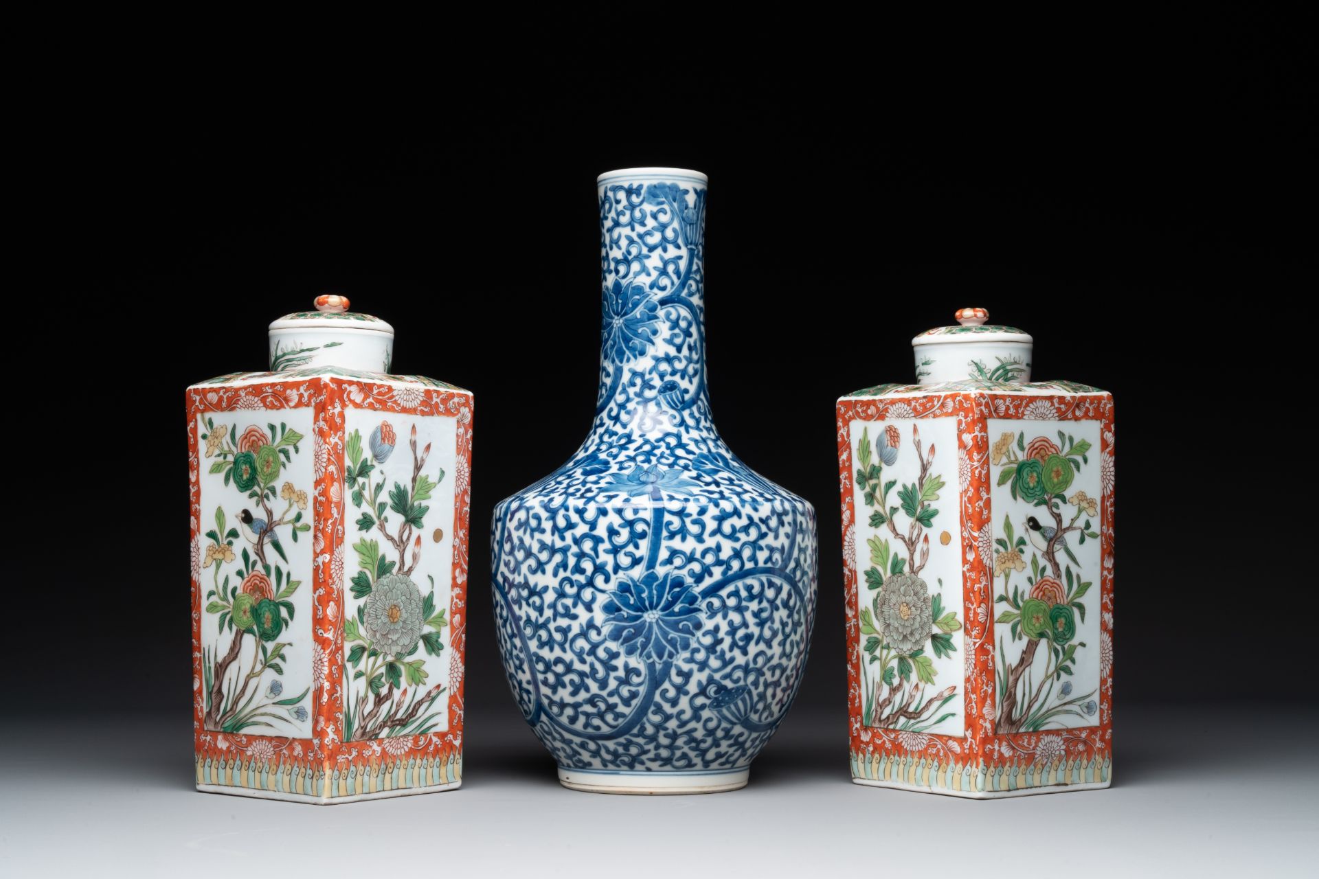 A Chinese blue and white bottle-shaped 'lotus scroll' vase and a pair of square famille verte flasks
