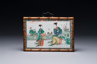 A Chinese rectangular famille verte plaque in wooden faux bamboo frame, Kangxi