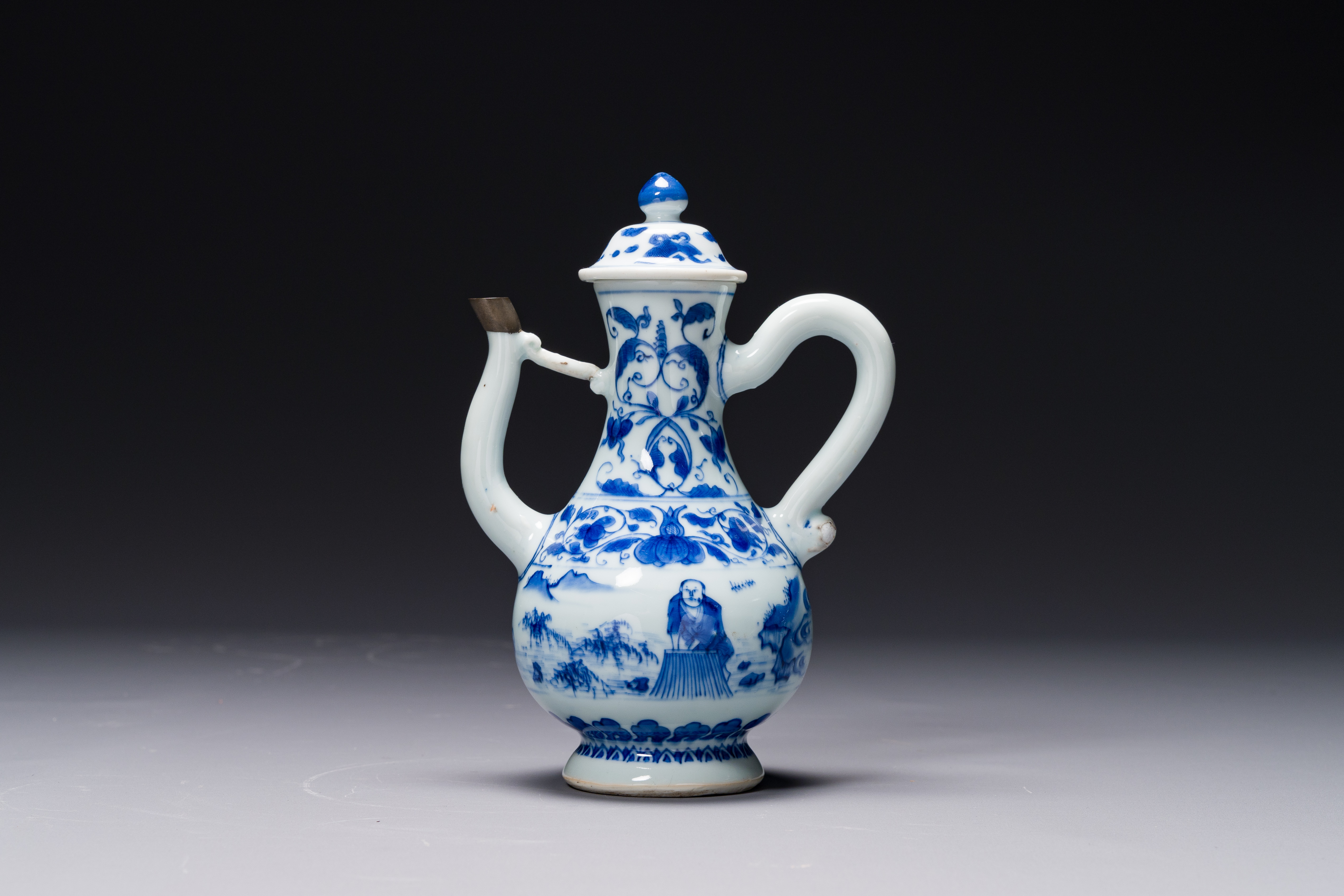 A Chinese blue and white 'fisherman and woodcutter' ewer and cover, Transitional period