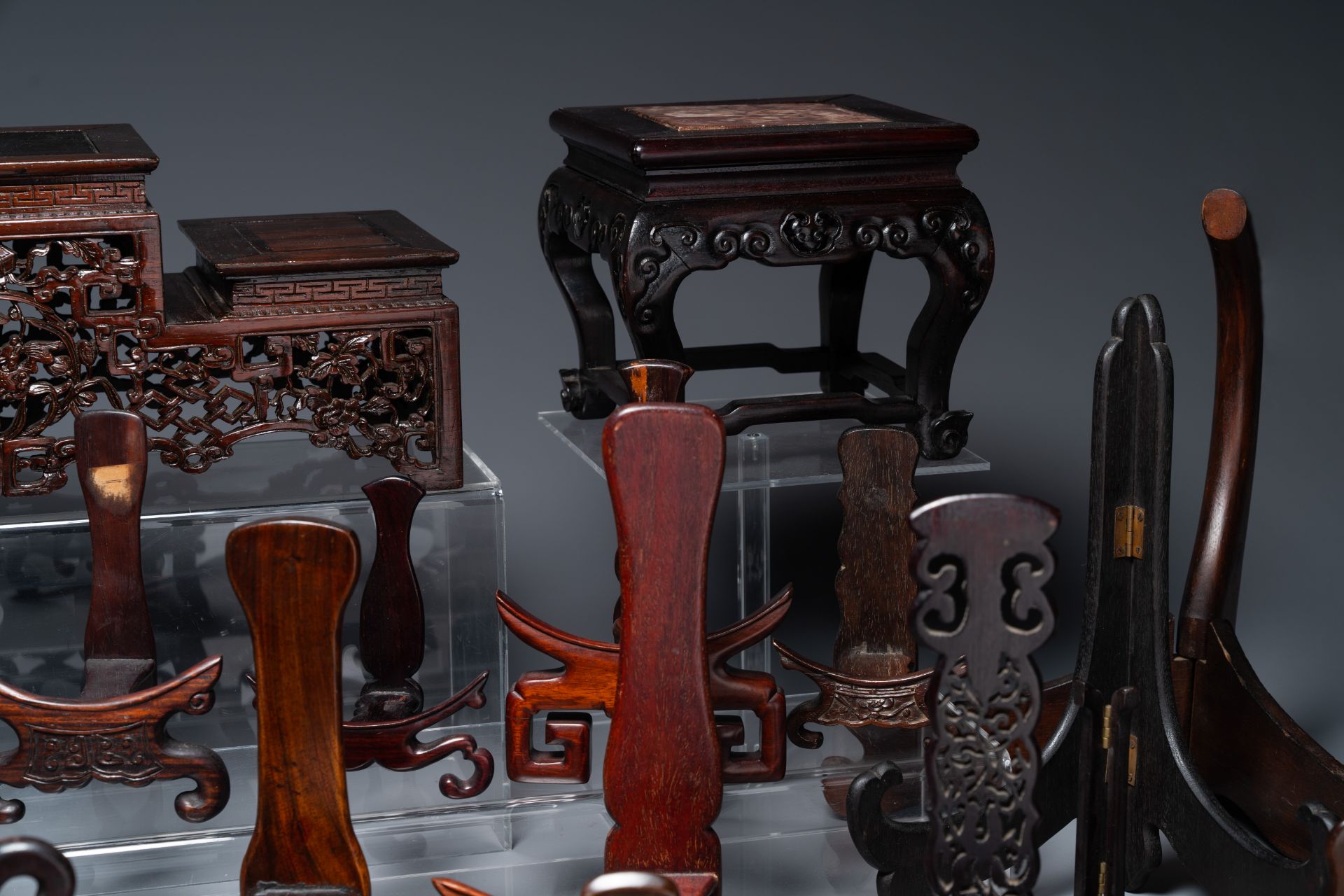 A collection of 26 varied Chinese wooden stands, 2 with marble tops, 19/20th C. - Image 3 of 6