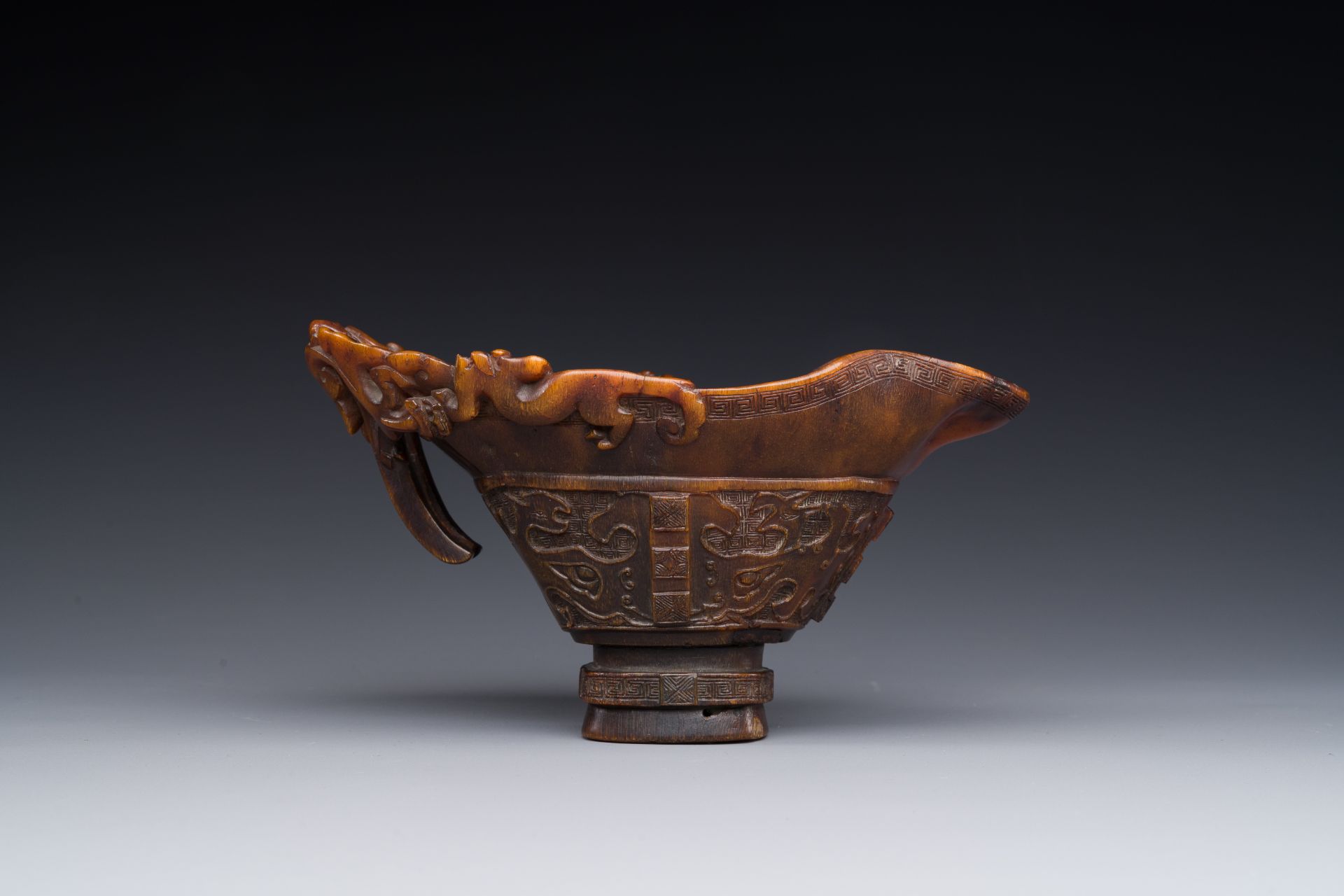 A Chinese carved rhinoceros horn 'libation cup' with chilong design, 17/18th C. - Image 5 of 8