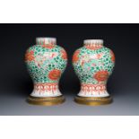 A pair of Chinese famille verte 'Buddhist lion' vases with gilt bronze mounts, Kangxi